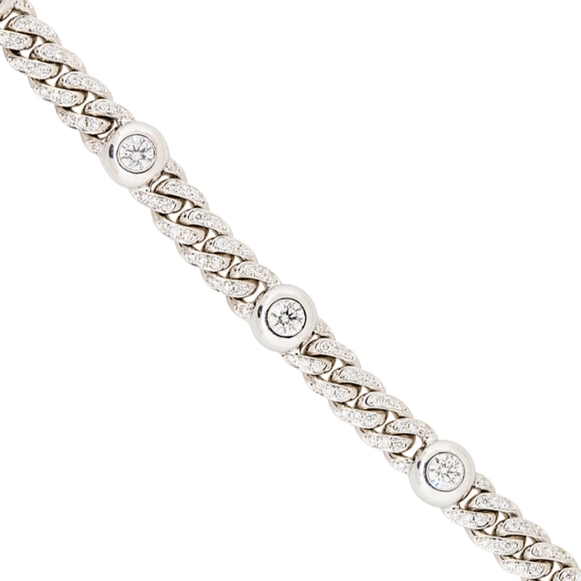 Material: 18K White Gold
Diamond Details: Approx. 5.30ctw of Round Cut Diamonds. This bracelet has 6 large bezel set diamond stations and the whole bracelet is pave diamonds. Diamonds are H/I in color and SI in clarity
Clasp: Tongue In Box