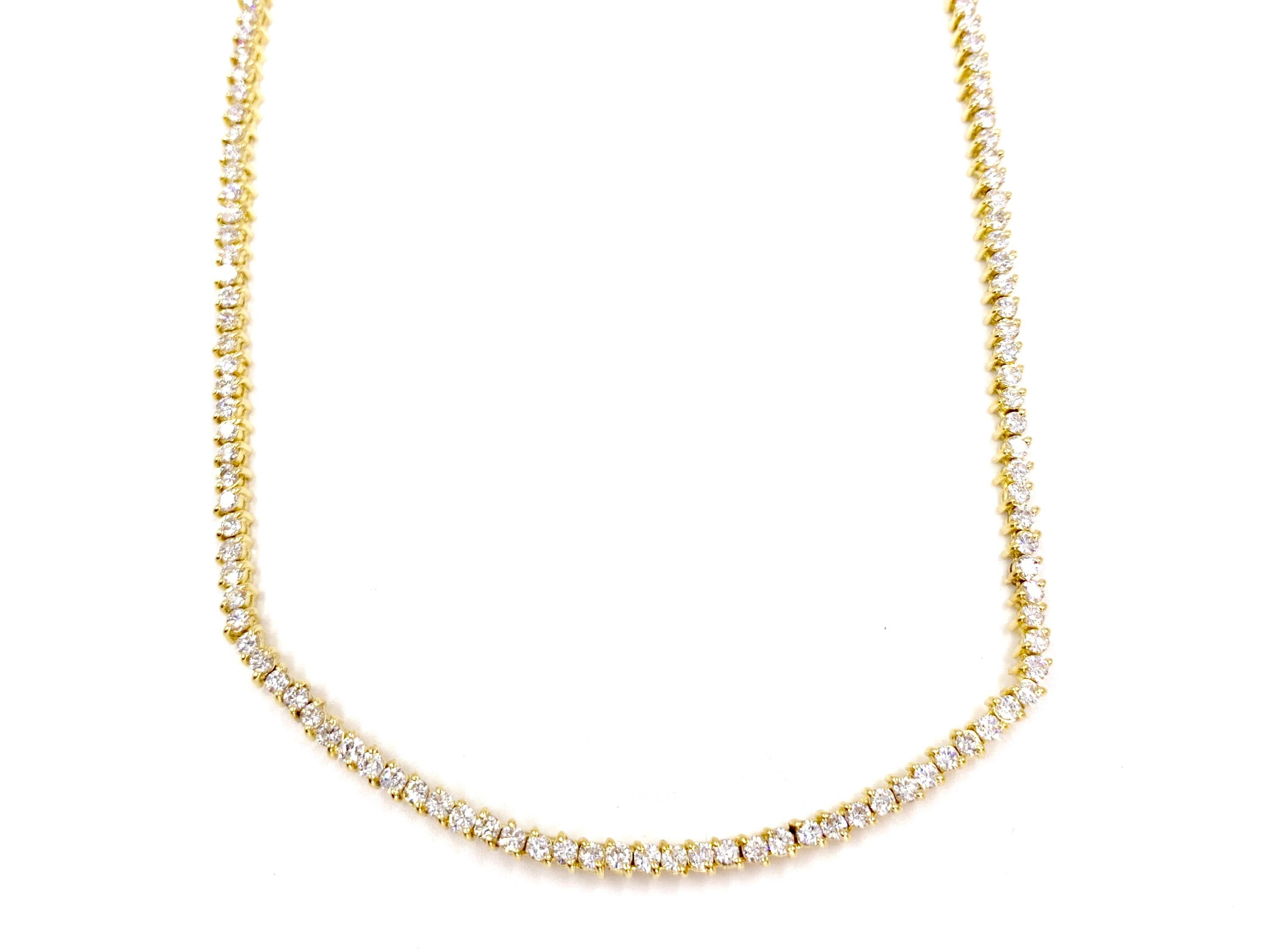 The perfect every day diamond tennis necklace featuring 189 round brilliant diamonds at 5.30 carats total weight beautifully prong set in 18 karat yellow gold. Diamond quality is approximately F-G color, VS1 clarity. Necklace is designed with the