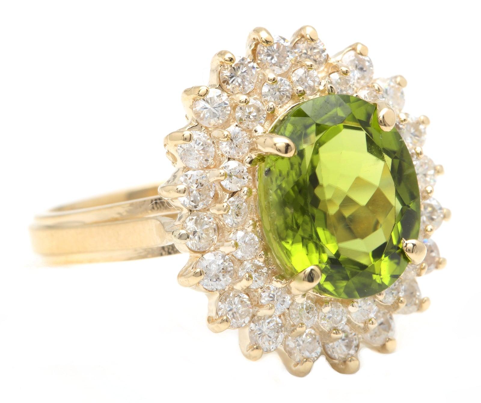 5.30 Carats Impressive Natural Peridot and Diamond 14K Yellow Gold Ring

Suggested Replacement Value: Approx. $5,500.00

Total Natural Peridot Weight is: Approx. 4.00 Carats

Peridot Measures: Approx. 11.00 x 9.00mm

Natural Round Diamonds Weight: