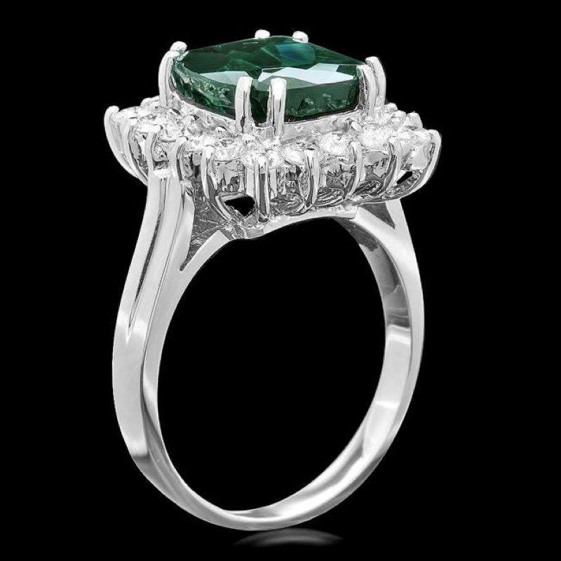 5.30 Carats Natural Green Tourmaline and Diamond 14K Solid White Gold Ring

Total Natural Tourmaline Weight is: Approx. 4.40 Carats 

Tourmaline Measures: Approx. 9.00 x 10.00mm

Natural Round Diamonds Weight: 0.90 Carats (color G-H / Clarity