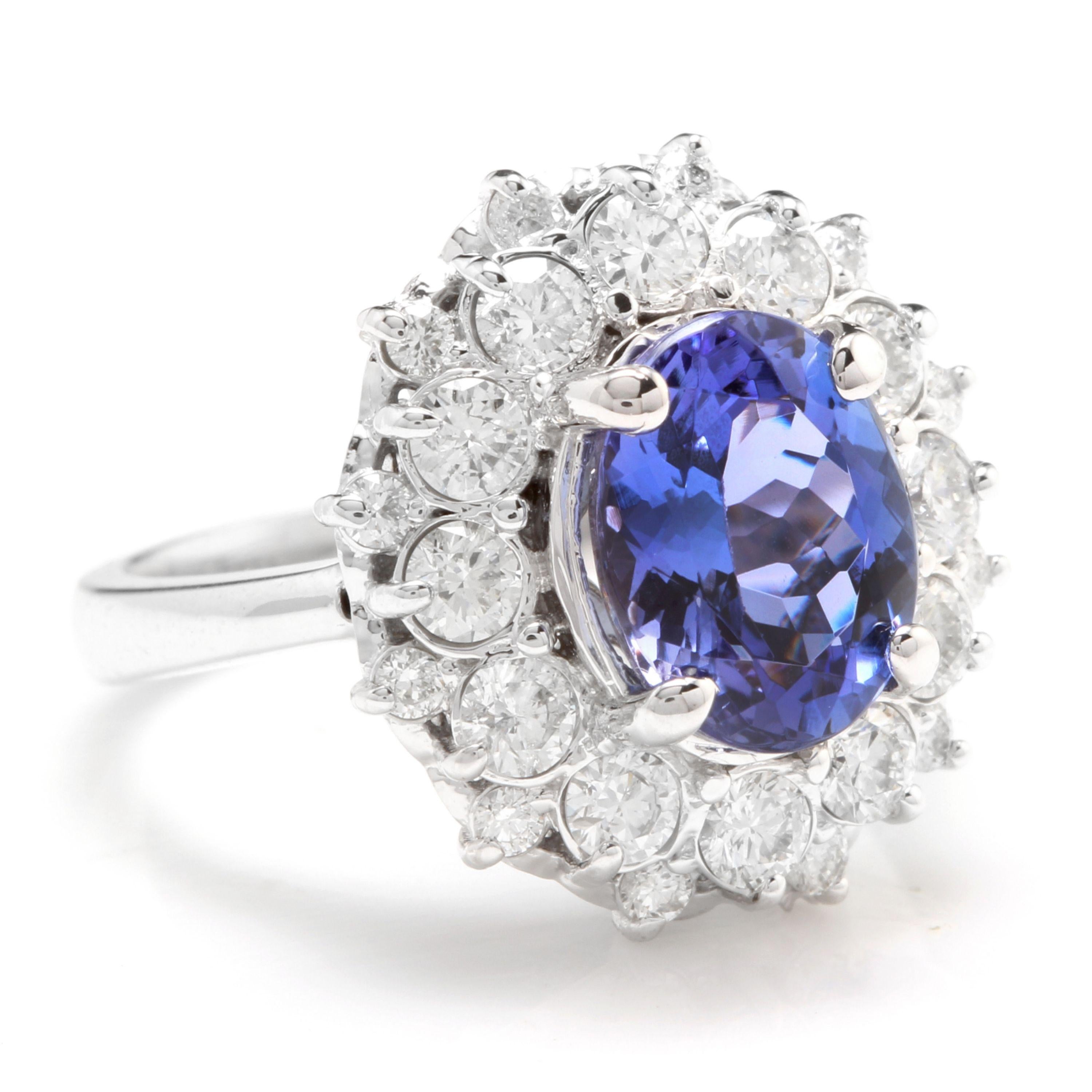5.30 Carats Natural Very Nice Looking Tanzanite and Diamond 14K Solid White Gold Ring

Total Natural Oval Cut Tanzanite Weight is: Approx. 4.00 Carats

Tanzanite Measures: 10.00 x 8.00mm

Natural Round Diamonds Weight: Approx. 1.30 Carats (color G-H