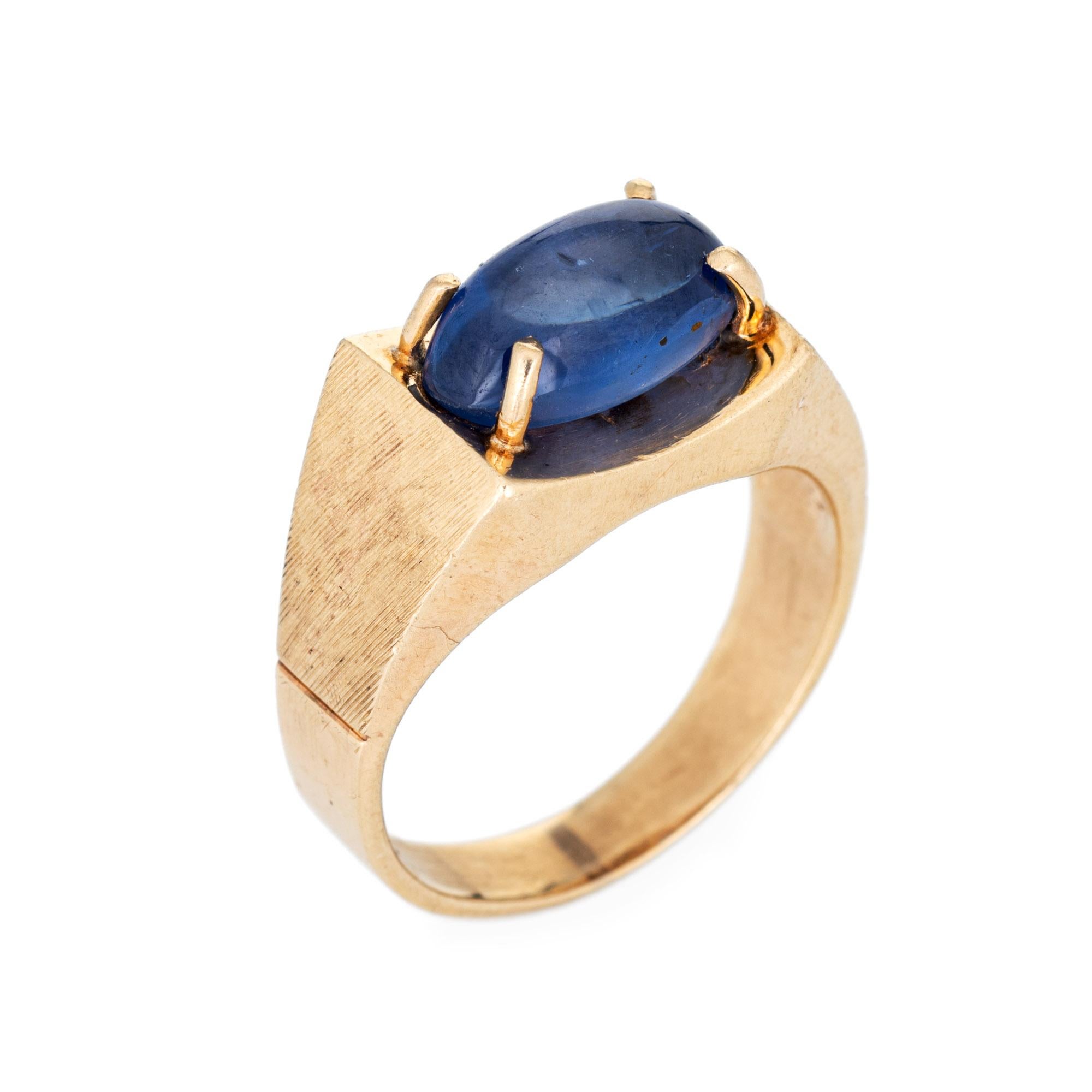 Stylish vintage natural Ceylon star sapphire ring crafted in 14 karat yellow gold (circa 1970s). 

Natural star sapphire, approx. 5.30ct (12.1 x 7.0 x 5.8mm), medium-dark blue color, lightly included, high polish. A faint star is visible under a