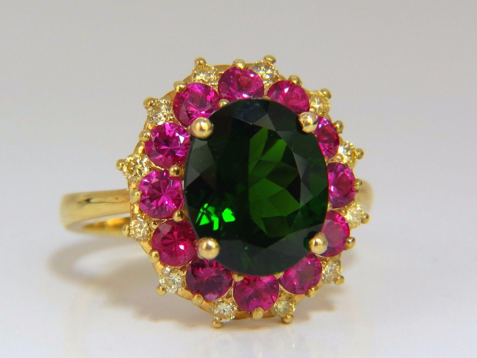 Natural Green Diopside Multi-Halo Cluster

3.40ct Oval, Full cut Brilliant Natural Diopside

11.4 x 9mm 

Clean Clarity & Transparent.

Prime Vivid Deep Green

1.60ct Natural round Rubies.

Clean Clarity & Transparent.

.30ct  Round diamonds 

Fancy