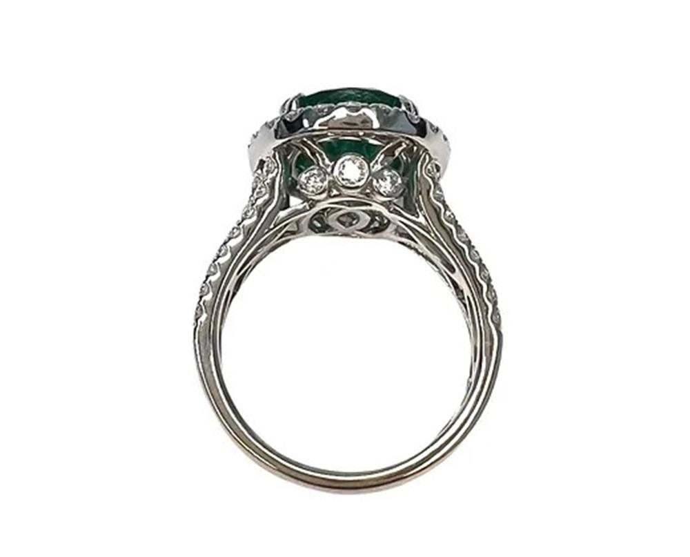 Emerald Weight: 5.31 CTS, Measurements: 13.1 x 10.3 mm, Diamond Weight: 1.22 CTS, Metal: 18K White Gold, Ring Size: 6, Shape: Oval, Color: Green, Hardness: 7.5-8, Birthstone: May