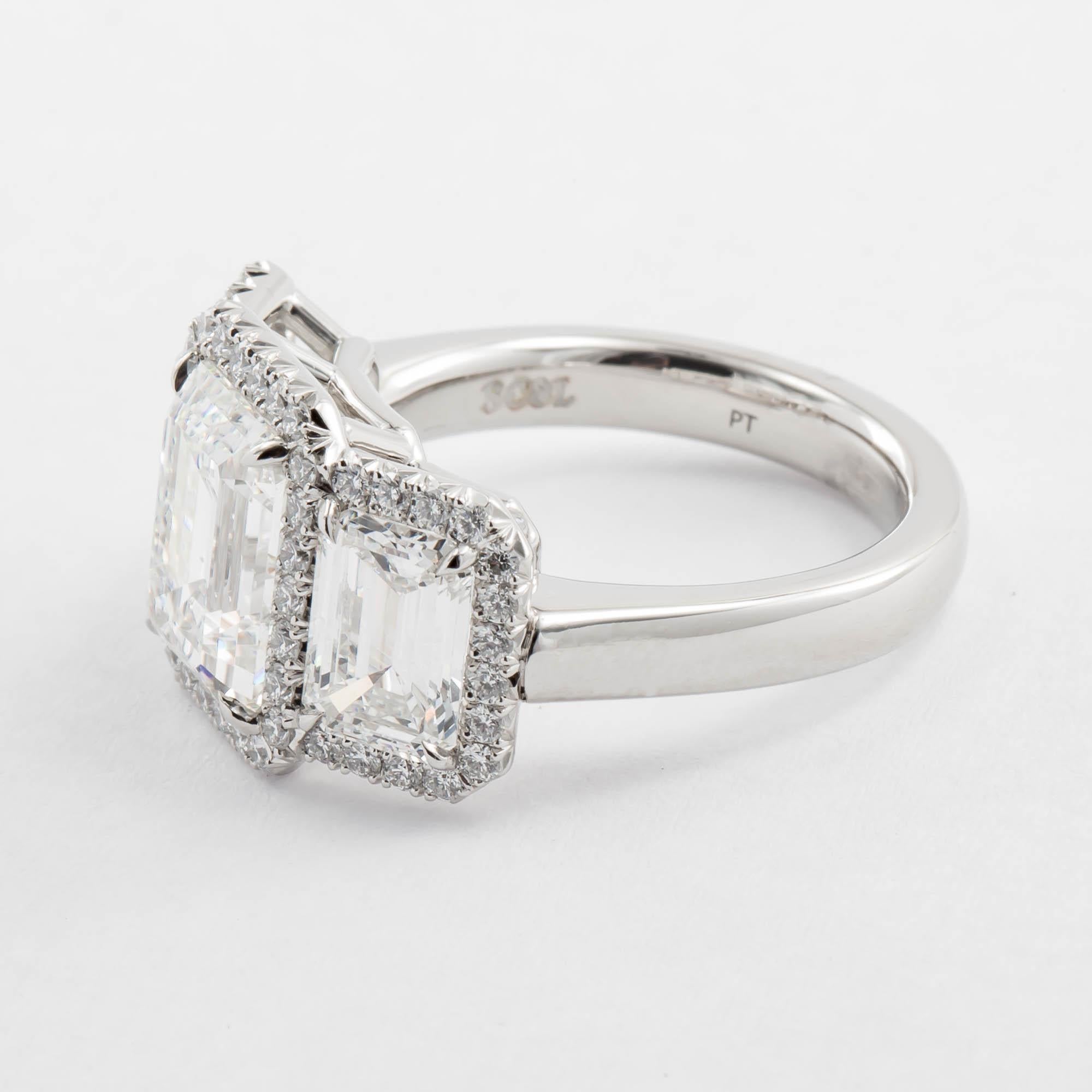 Modern 5.31 Carat Three-Stone Emerald Cut Diamond Ring Platinum For Sale