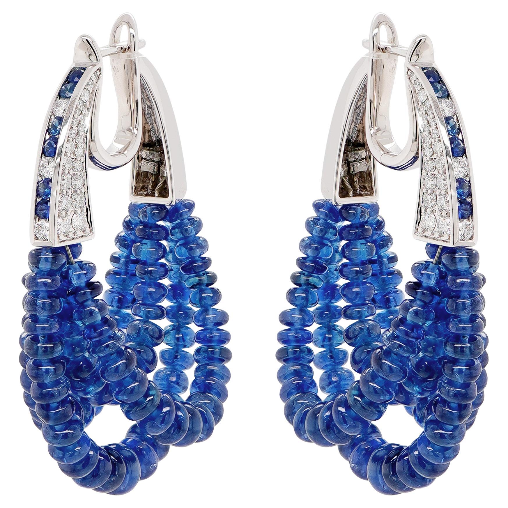 53.19 Carats Vivid Blue Sapphire & 0.75 Carats F VS Head Turner Earring 18K For Sale