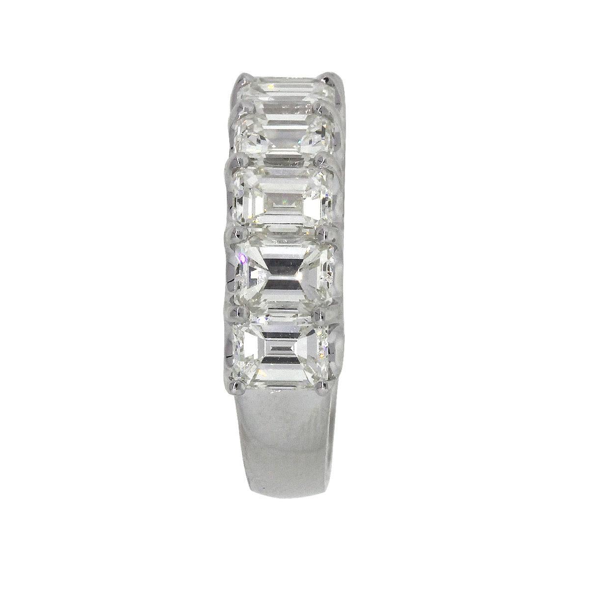 Material: 18k White Gold
Diamond Details: 11 stones, approximately 5.32ctw of Emerald Cut Diamonds. Diamonds are G/H in color and SI in clarity
Size: 6.25
Total Weight: 5.5g (3.5dwt)
Measurements: 0.90″ x 0.20″ x 0.85″
SKU: A30312248