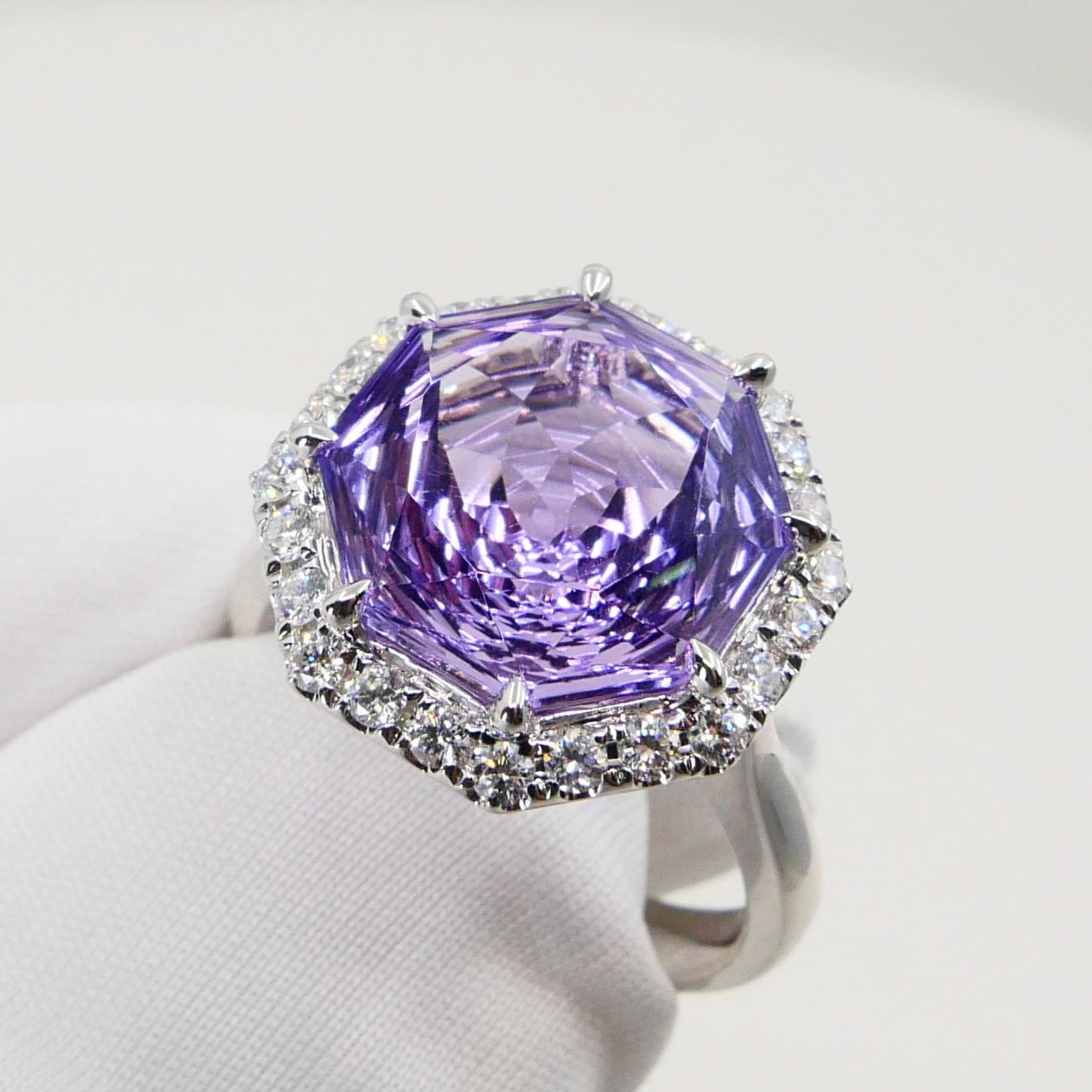 Please check out the HD video! Here is a super unique flower cut amethyst and diamond cocktail statement ring. It is set in 18k white gold. The 5.32 cts center amethyst is stunning. The flower cut is spectacular and is rarely seen cut to this kind