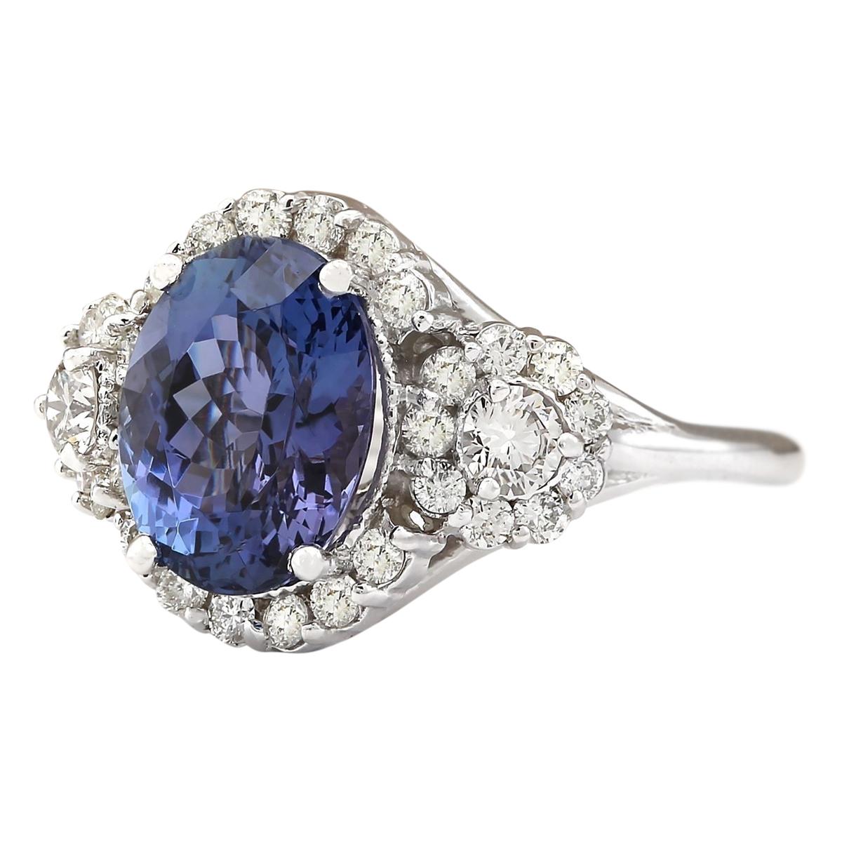 Stamped: 14K White Gold
Total Ring Weight: 6.5 Grams
Total Natural Tanzanite Weight is 4.32 Carat (Measures: 11.00x9.00 mm)
Color: Blue
Total Natural Diamond Weight is 1.00 Carat
Color: F-G, Clarity: VS2-SI1
Face Measures: 14.60x19.90 mm
Sku: