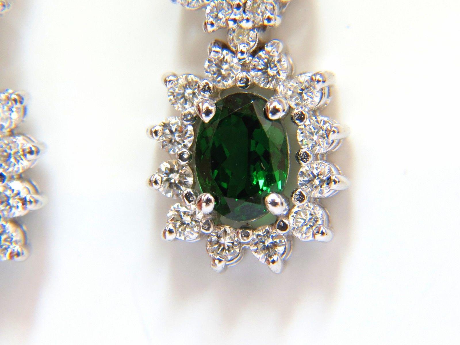 Dangling Double Halo Tsavorite & Diamond Earrings

3.32ct. Natural Vivid Green Tsavorites

6.8 X 5.2mm (larger)

6.8 X 4.8mm (upper / smaller)

Full cut oval brilliants.

Excellent, clean clarity & transparent 



2.00ct. round, full cut