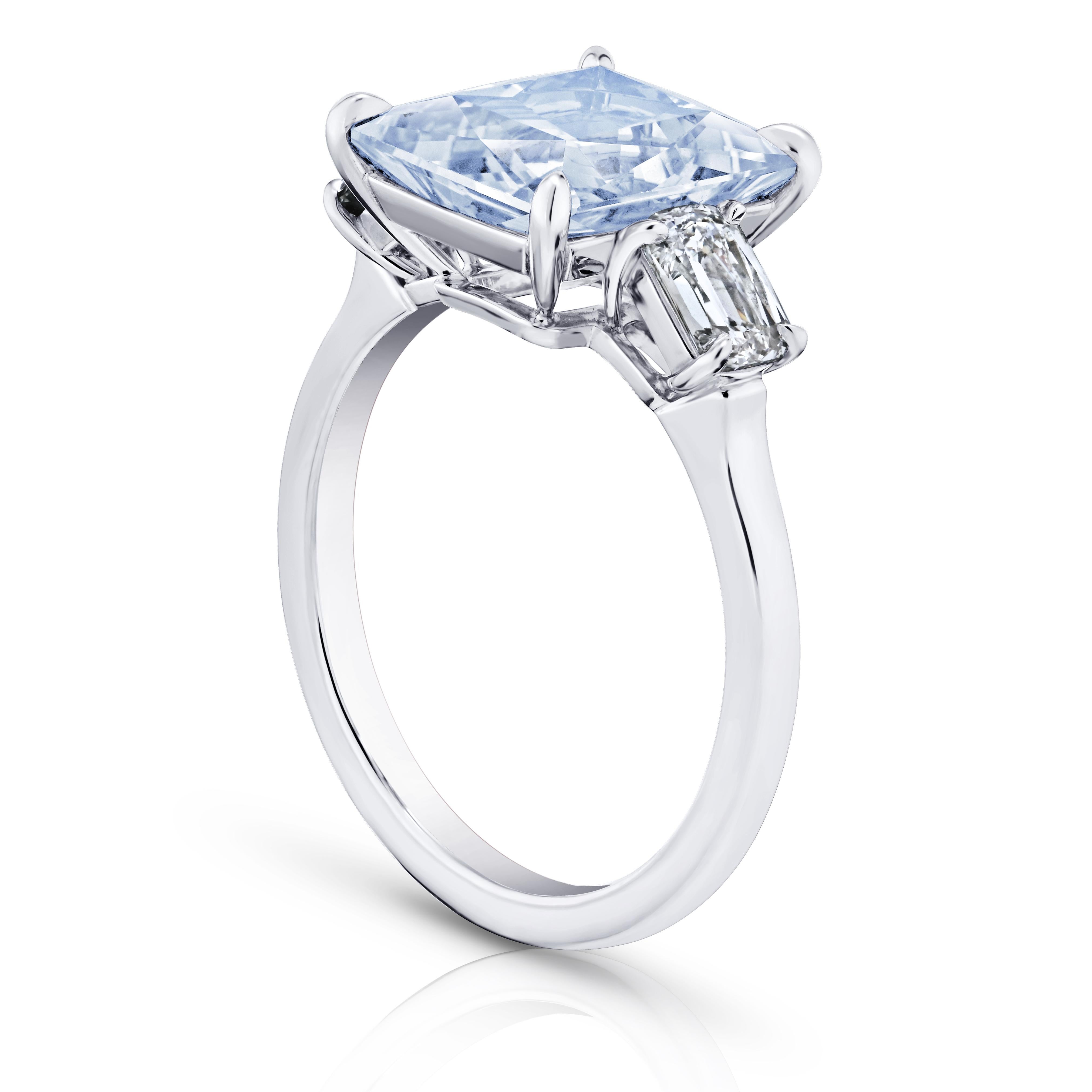 5.32 Carat Radiant Light Blue Natural Sapphire with two antique cushion cut diamonds set in a hand made platinum ring