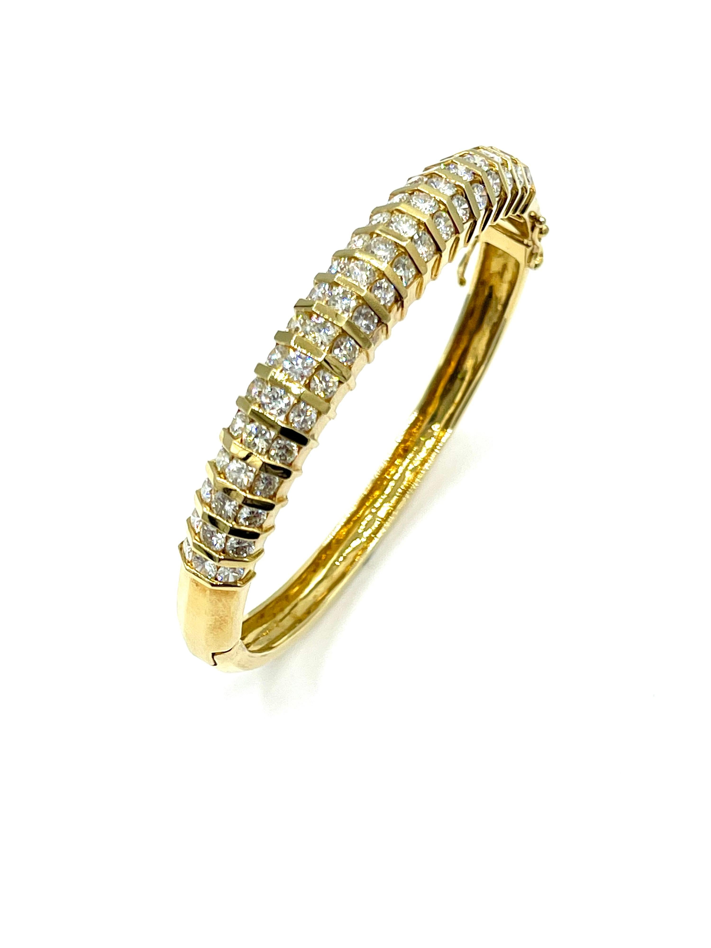 This is a beautiful retro style Diamond bangle bracelet!  The 57 round brilliant Diamonds are bar set in 18K yellow gold, with a total weight of 5.32 carats.  The diamonds are graded as G-H color, VS clarity.  These Diamonds have amazing fire to