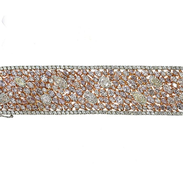 Elegant, exquisite, and luxurious Natural Fancy Color Diamond Bracelet, featuring 53.25 Carats of Natural Pink Diamonds, Natural Yellow Diamonds, and White Diamonds made by Shimon's Creations. As a leader in the natural fancy color diamond industry,