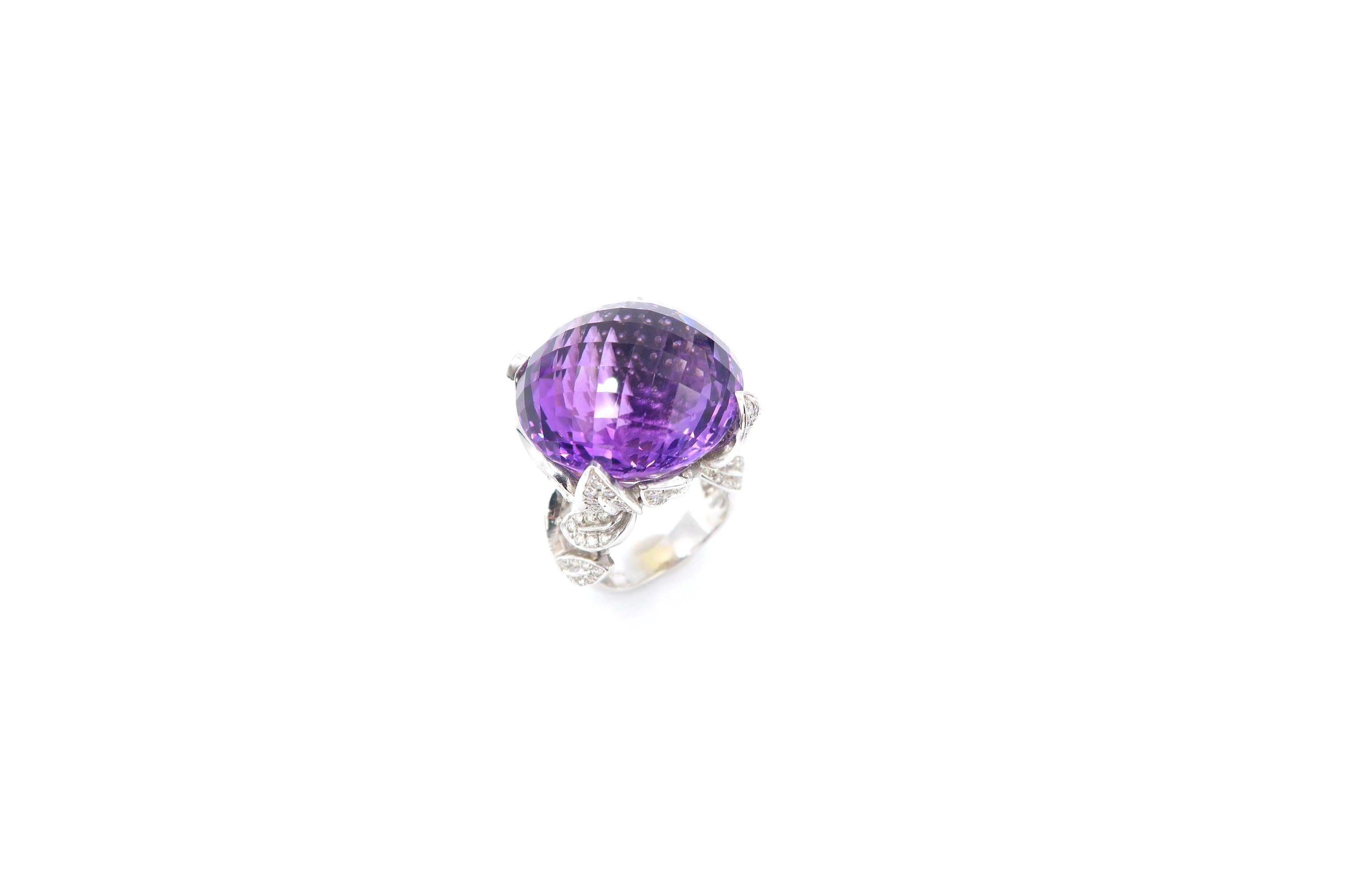 53.26 Carat Special-Cut Amethyst Ring in 18K Gold with Diamond Pavé Olive Leaves Detail

Amethyst: 53.26cts.
Diamond: 1.99ct.
Gold: 18K Gold 19.438g.

Ring size: 55 / US 7
Please let us know should you wish to have the ring resized.