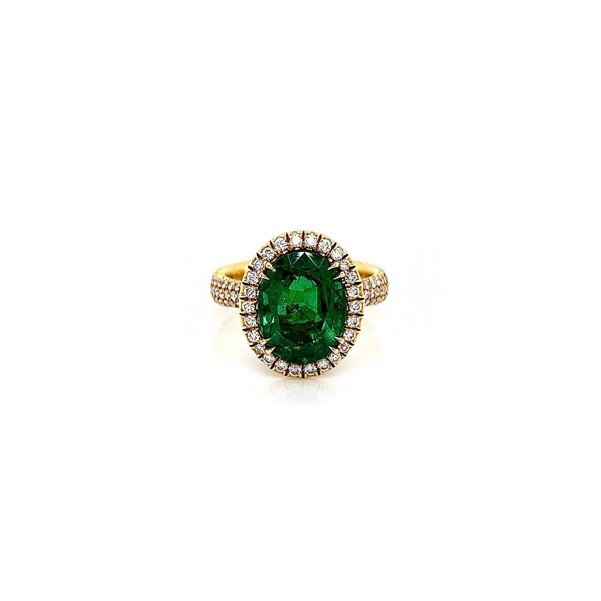 5.32 Total Carat Emerald and Diamond Halo Pave-Set Ladies Ring. GIA Certified.

-Metal Type: 18K Yellow Gold
-4.30 Carat Oval Cut Natural Colombian Beryl Emerald, GIA Certified 
-Emerald Color: Green
-1.02 Carat Round Natural side Diamonds. F-G