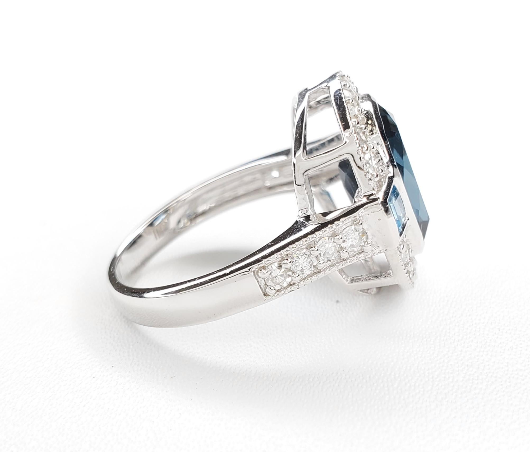 5.32cttw London Blue Topaz Sterling Silver Ring - Size 7

1 London Blue Topaz Cushion - 4.30cttw 
2 Swiss Blue Topaz Square - 0.34cttw 
18 White Diamond S/C Round -0.45cttw 	
8 White Diamond S/C Round - 0.23cttw 

.925 Sterling Silver w/ Rhodium
