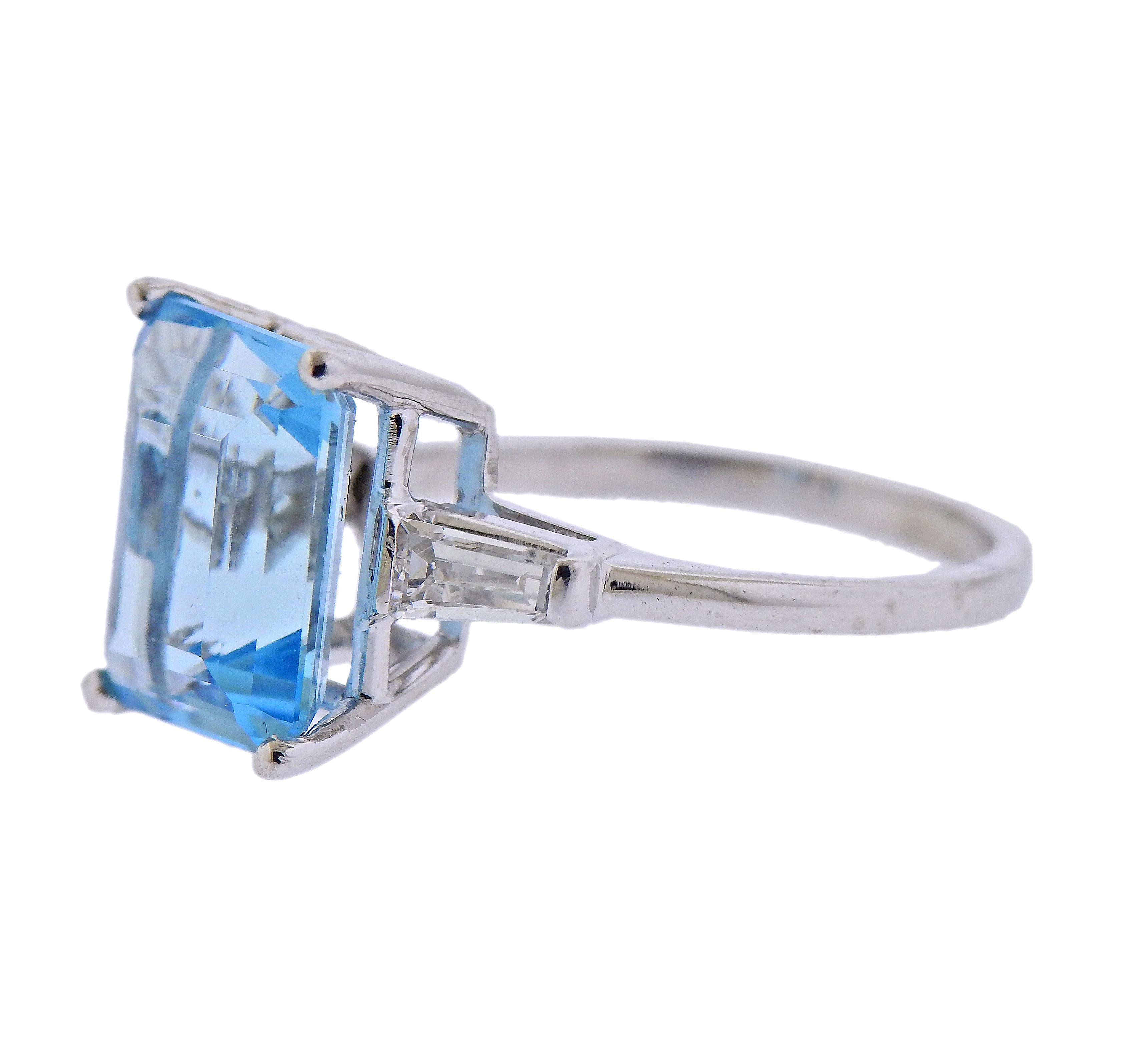 Platinum ring, set with center approx. 5.33ct aquamarine (measuring 12.62 x 10.03 x 6.15mm) set with two  tapered baguette diamonds on each side, approx. 0.24ctw total. Ring size - 8.5, weighs 6.5 grams. 