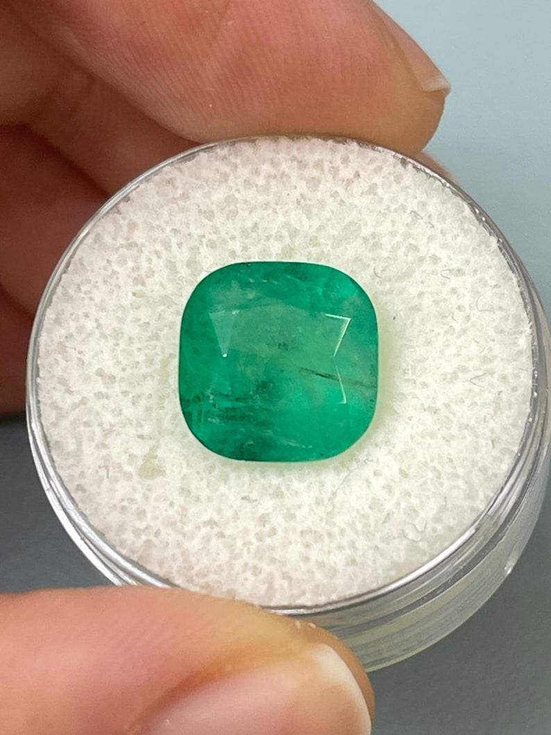 Stone: Emerald
Weight: 5.33-carats
Shape: Cushion Cut
Clarity: Semi-Transparent
Luster: Good
Color: Medium Green
Measurements: 10.83mm x 10.73mm x 7.49mm
Geographic Origin: Colombia
Treatment: Natural, Oiling

Comments: Due to their growth
