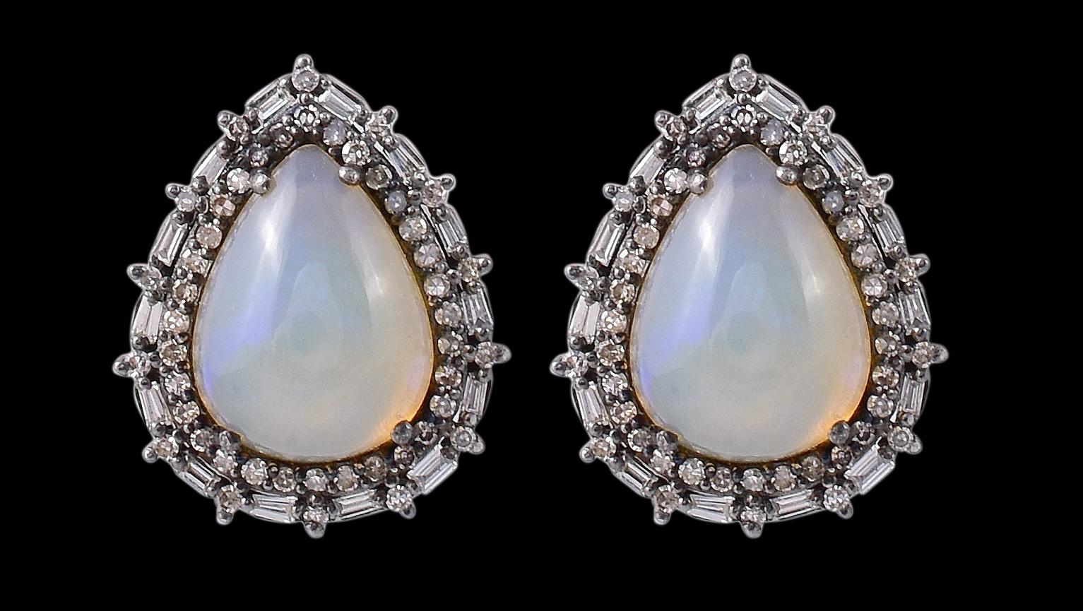 5.33 Carat Opal and Diamond Cluster Stud Earrings in Art-Deco Style

This Victorian concept magnificent fire rainbow opal and diamond stud earring is majestic. The solitaire beautiful pear cabochon opal is gracefully surrounded with a pave set
