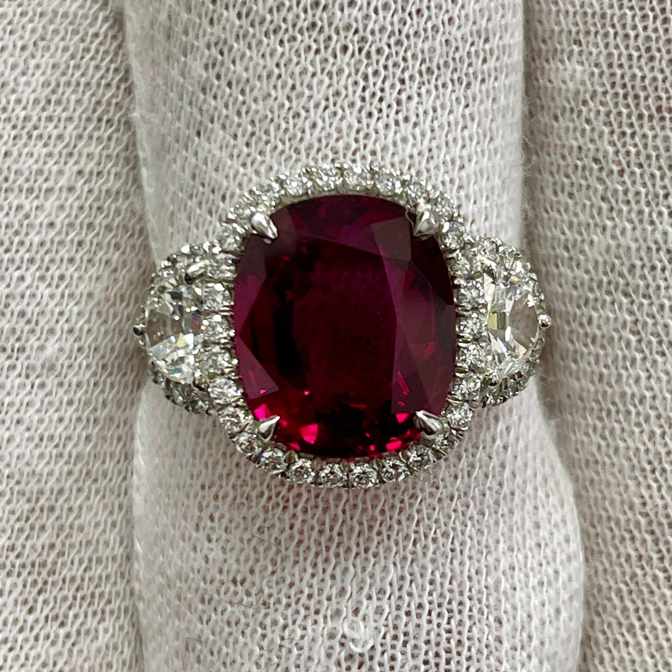 This is an incredibly spready ruby mounted in a platinum ring with 0.60Ct of brilliant white half-moon diamonds. Suitable for any occasion!