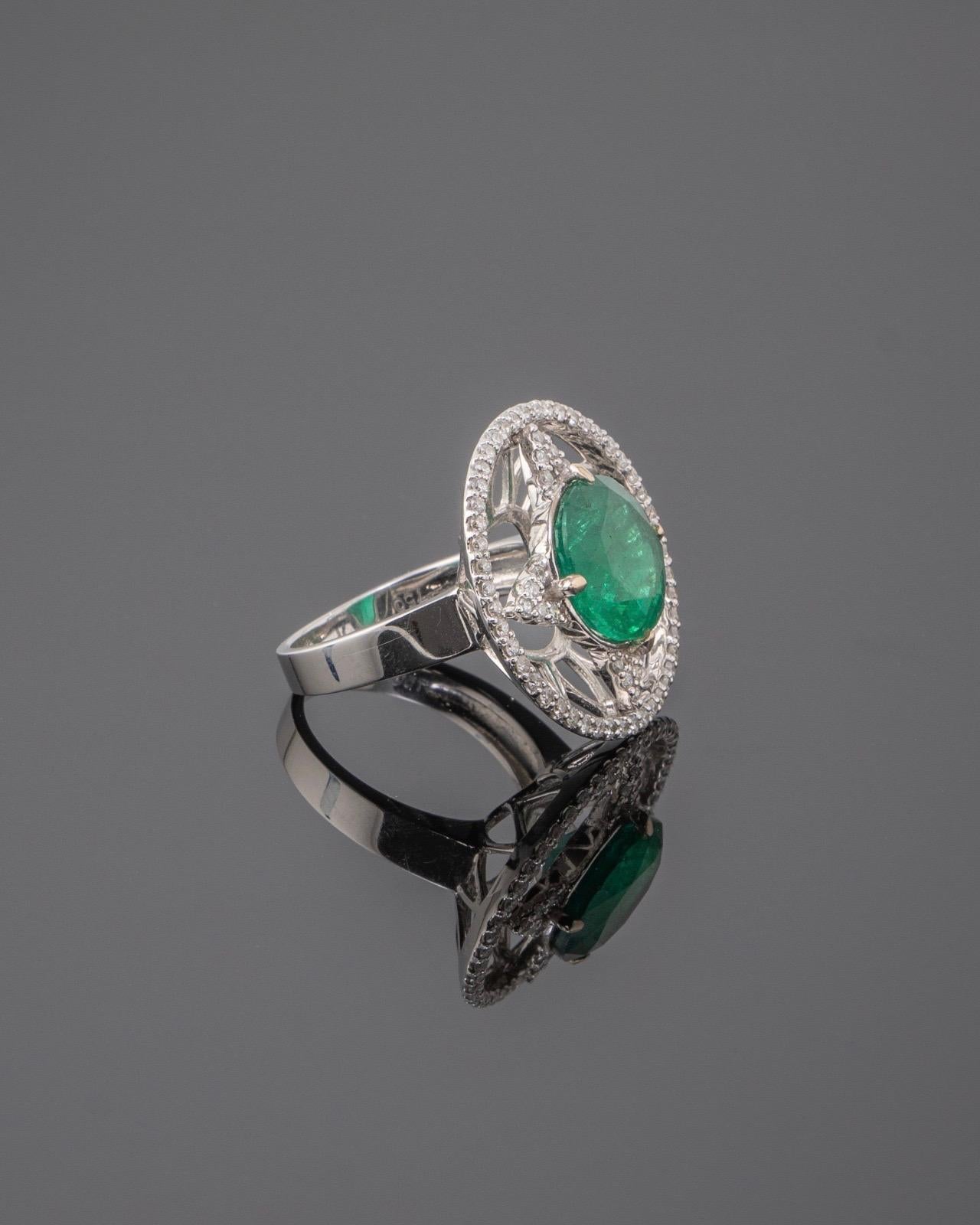 Make a statement with this beautiful, one of a kind cocktail ring, with a 5.34 carat Zambian Emerald centre stone and 1.98 carat White Daimonds, all set in solid 18K white gold. The emerald is of great lustre and has an ideal colour. Currently a