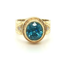 5.34 ct. Blue Zircon, Diamond Yellow Gold Bezel Hand Engraved Signet Band Ring