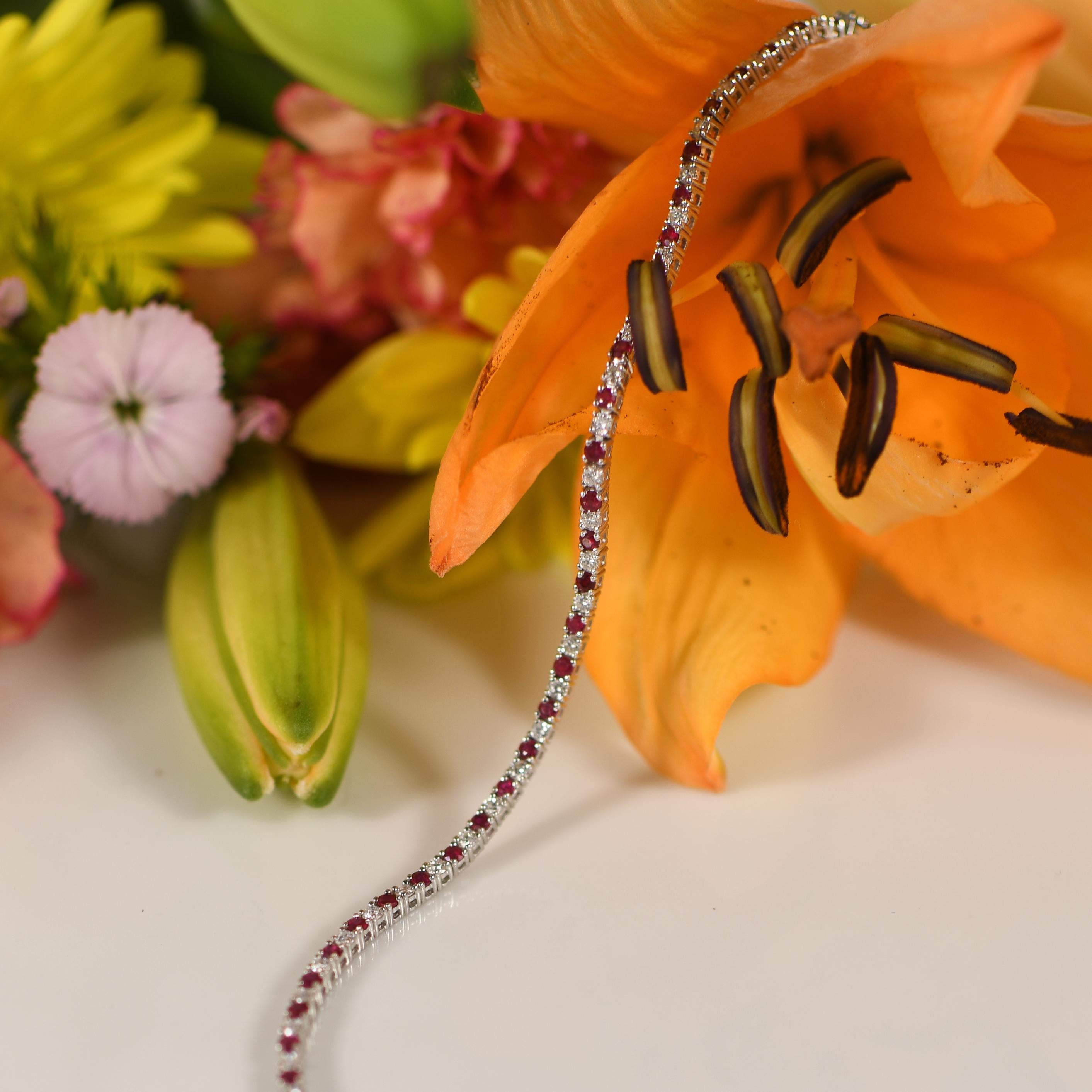 Radiating with timeless allure, this stunning bracelet boasts a total weight of 5.34 carats, adorned with radiant rubies and dazzling diamonds. Crafted from gleaming 14K white gold, its intricate design showcases the fiery red hue of the rubies