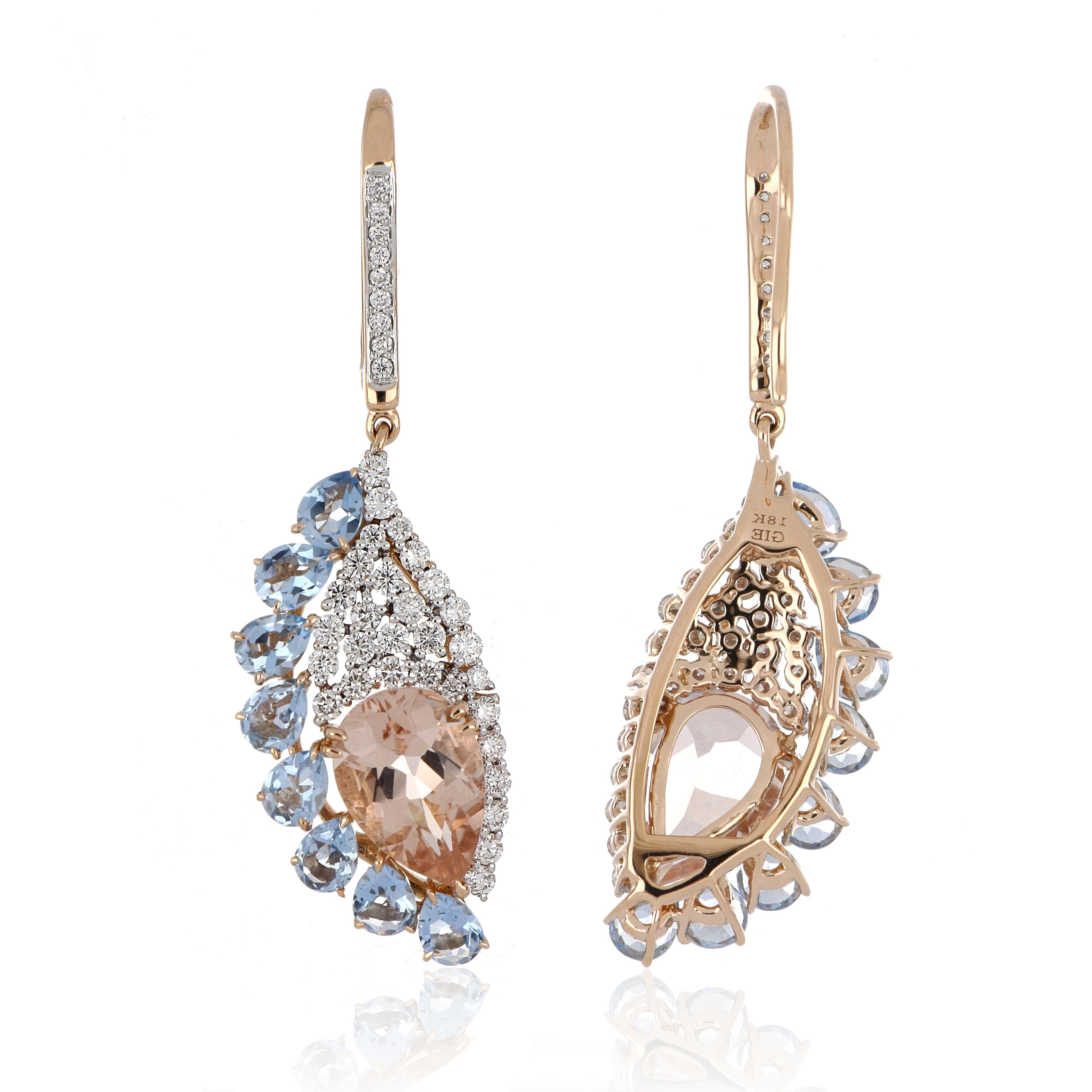 Elegant and Exquisitely detailed Gold Earrings, set with 3.46 Ct Pear Cut Morganites surrounded by 1.89 Cts (total) Pear Cut Aquamarine, accented with micro pave Diamonds, weighing approx. 0.86 Cts. total carat weight. Beautifully Hand crafted in 18