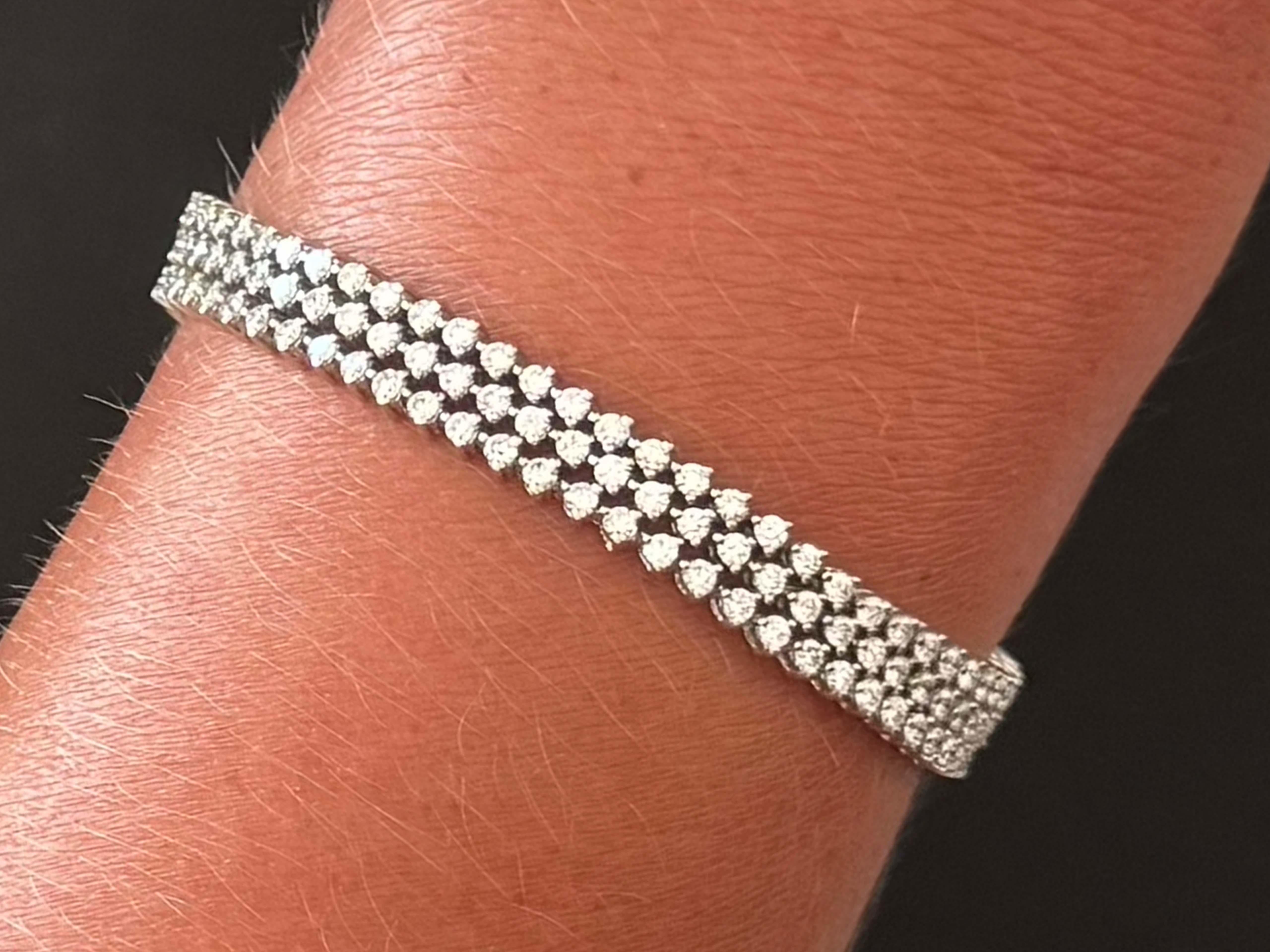 Bracelet Specifications:

Metal: 18k White Gold

Diamond Count: 204 brilliant cut diamonds

Diamond Carat Weight: 5.35 carats

Diamond Color: G-H

Diamond Clarity: VS1-SI1

Bracelet Length: ~7.00