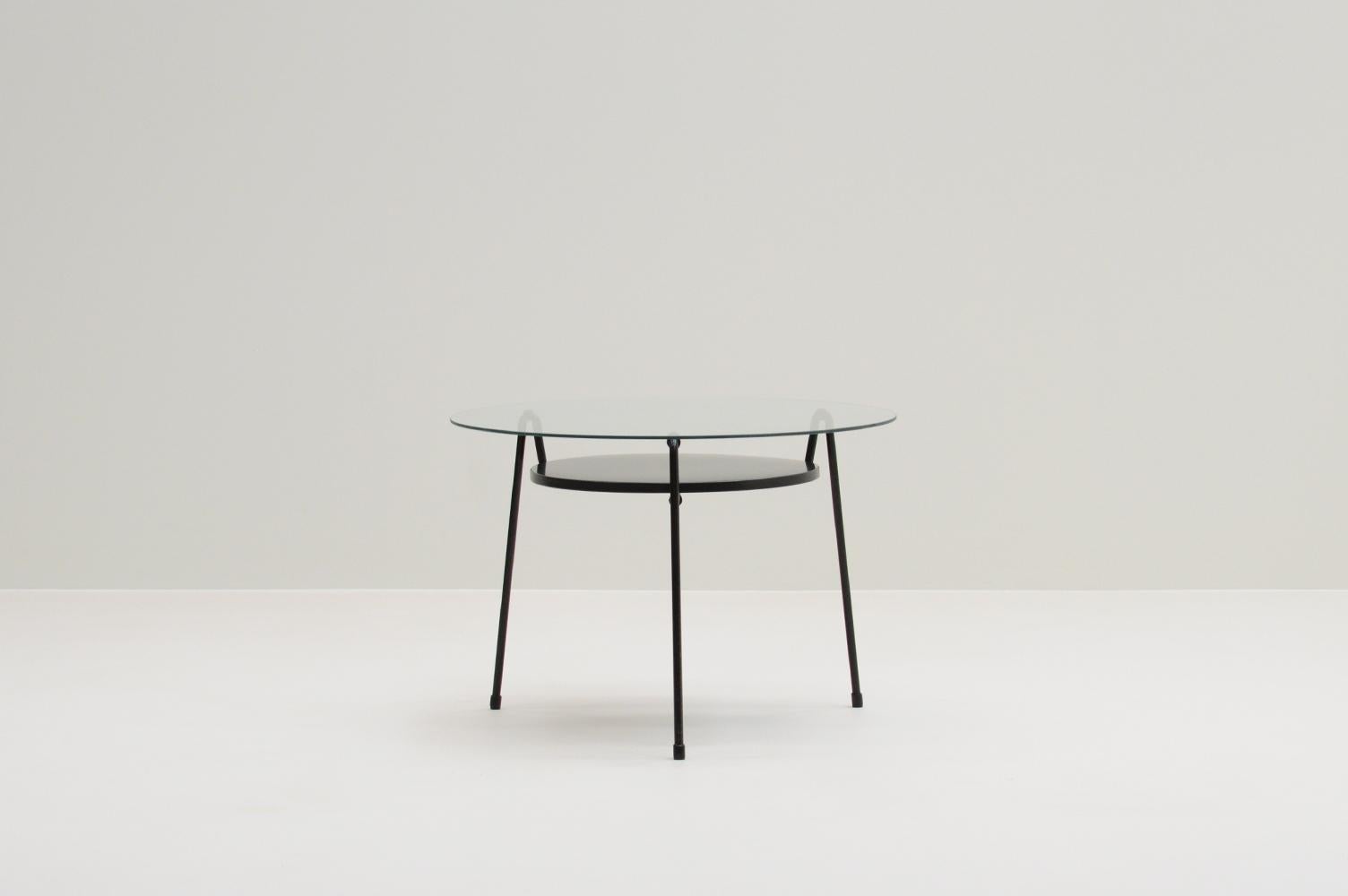 535 table by Wim Rietveld for Gispen, The Netherlands 50s. In 1953 Wim Rietveld designed the Model 535 side table, also known as the “Mug” (mosquito) table. Black 3-legged table with metal tray and glass top. Some scratches on the glas top, but in