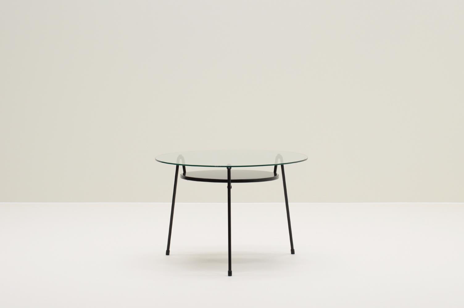 535 table by Wim Rietveld for Gispen, The Netherlands,1950s. In 1953 Wim Rietveld designed the Model 535 side table, also known as the “Mug” (mosquito) table. Black 3-legged table with metal tray and its original glass top. Some scratches in the