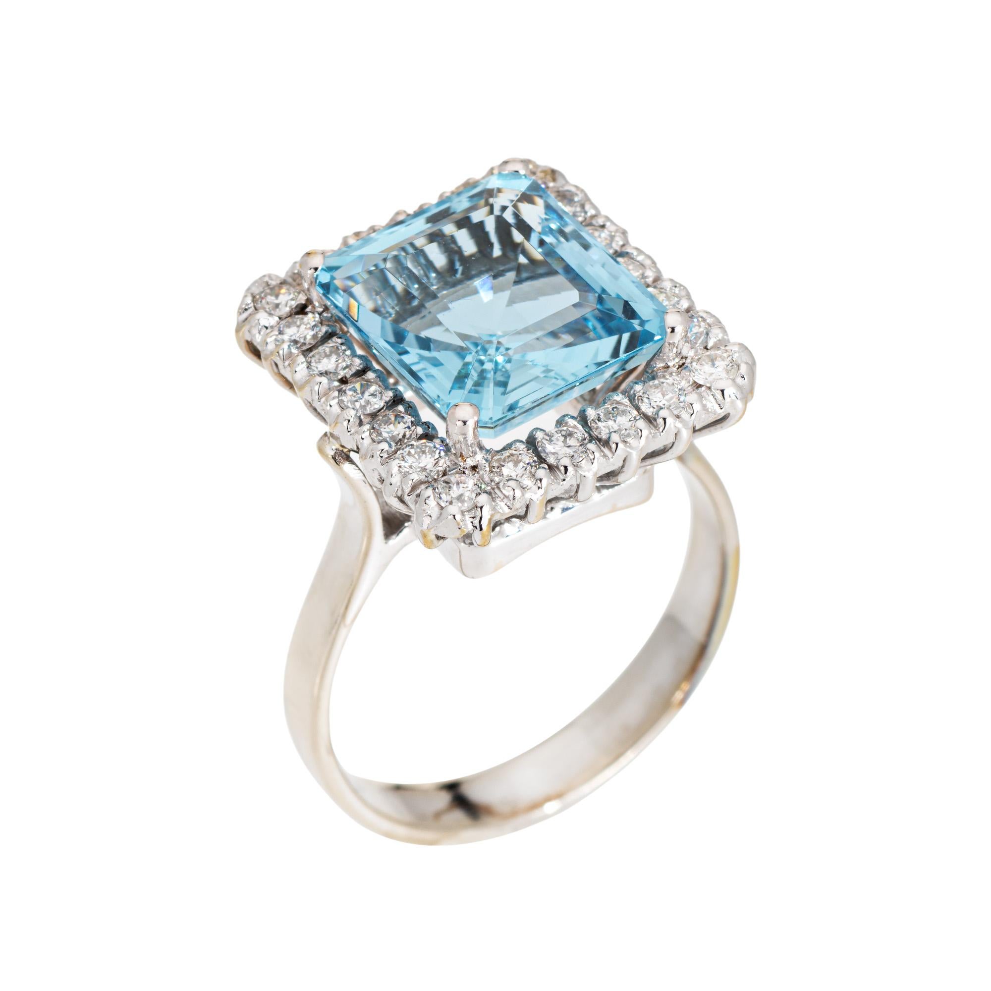 Stylish and finely detailed aquamarine & diamond ring crafted in 18 karat white gold (circa 1970s to 1980s).

Emerald cut aquamarine measures 11.9 x 10.5 x 6.5mm (estimated at 5.35 carats). Diamonds total an estimated 0.65 carats (estimated at H-I