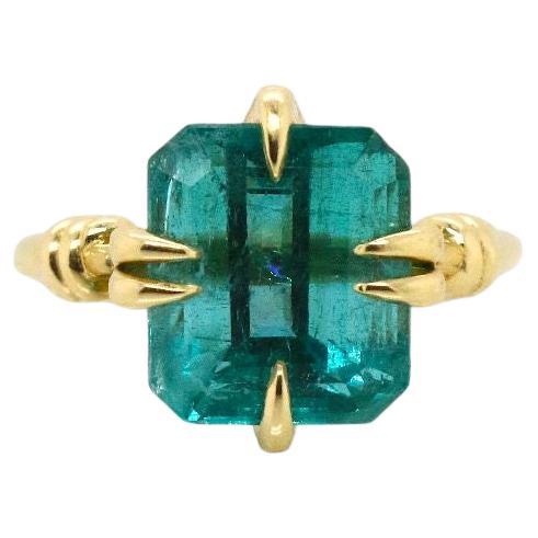 5.35ct Emerald Solitaire style Forget Me Knot ring in 18ct yellow gold