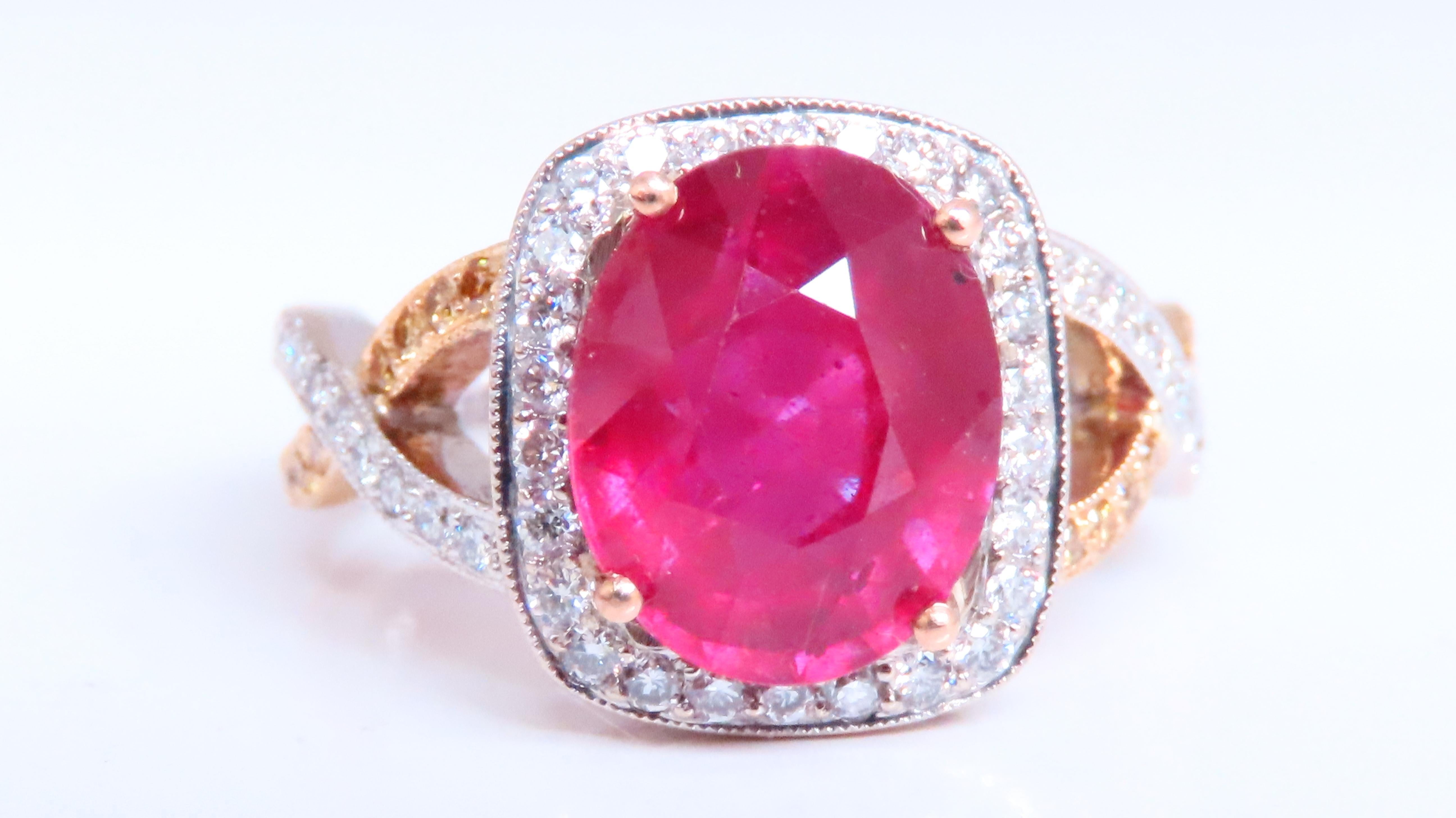 Anillo de rubí natural de 5,35 ct.
Relleno de vidrio, Mejorado.
11 x 9mm

.50ct Diamantes naturales laterales
G-color Vs-2 claridad.

.20ct Diamantes Amarillos Facny Naturales.

Oro blanco de 18 quilates
7.5 gramos

Cubierta del anillo: 13,3