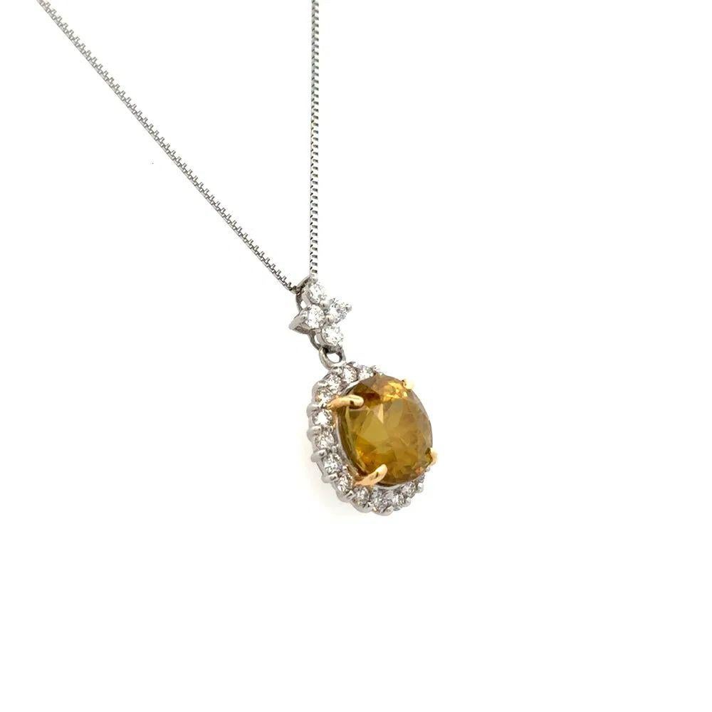 Simply Beautiful! Finely detailed Vintage Oval Sphene and RBC Diamond Platinum Pendant Necklace. Featuring a securely Hand set Oval Sphene Gemstone, weighing approx. 5.36 Carats. Surrounded by Round Brilliant Cut Diamonds, approx. 0.60tcw. Hand