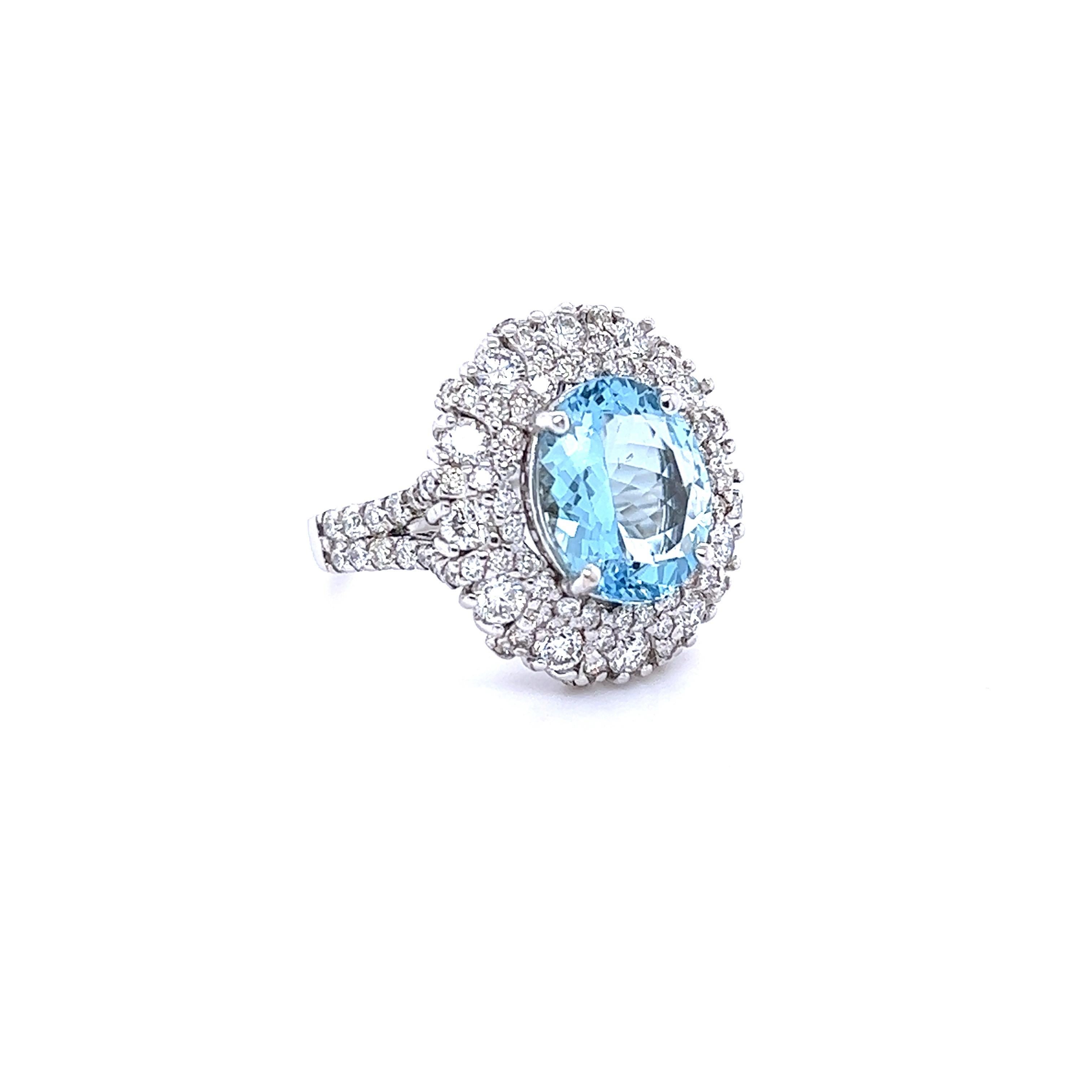 This ring has a beautiful 3.42 Carat Oval Cut Aquamarine and is surrounded by 100 Round Cut Diamonds that weigh 1.95 carat (Clarity: SI1, Color: F). The total carat weight of this ring is 5.37 carats. 
The Aquamarine is 12 mm x 10 mm and has a
