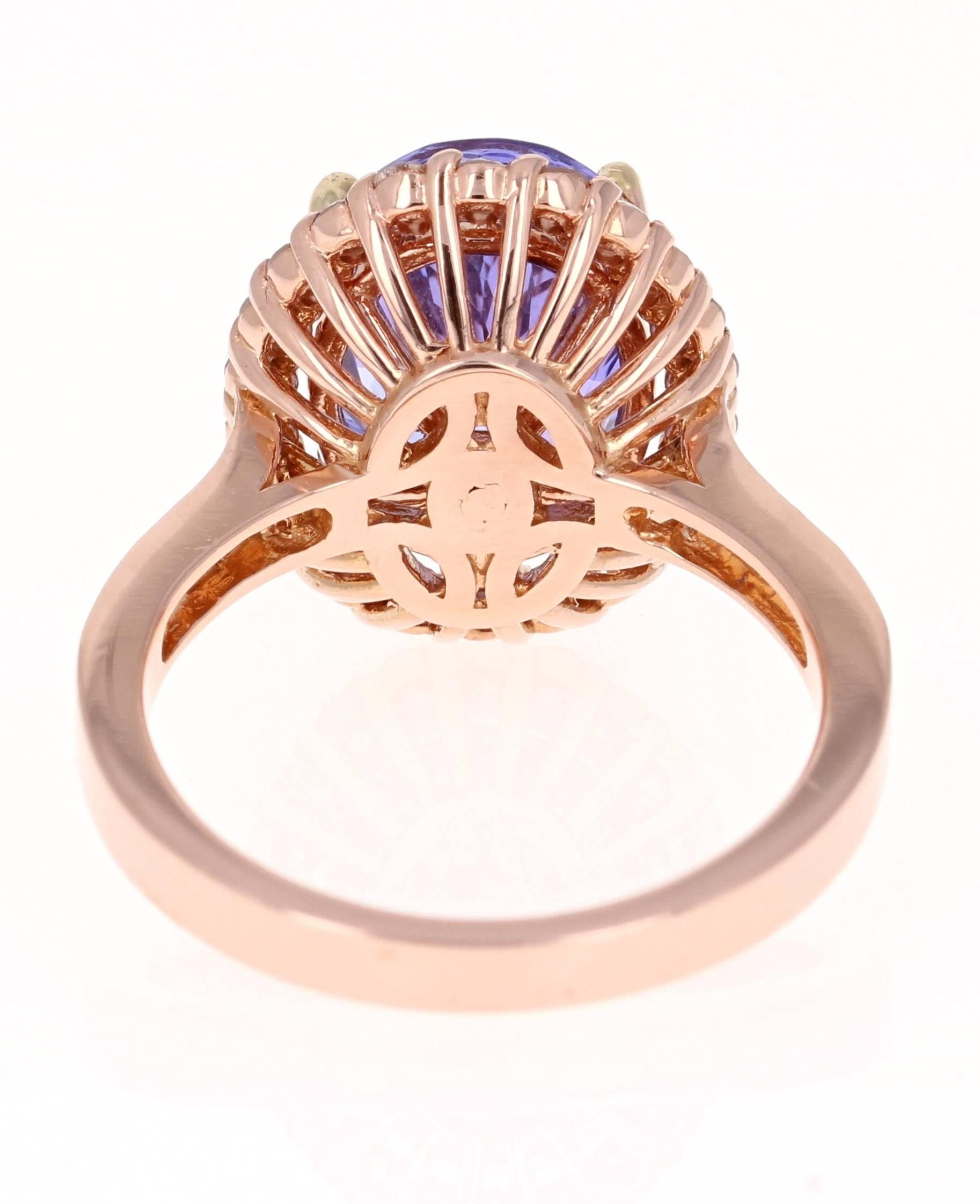 Contemporary 5.38 Carat Tanzanite Diamond Halo 14 Karat Rose Gold Ring For Sale