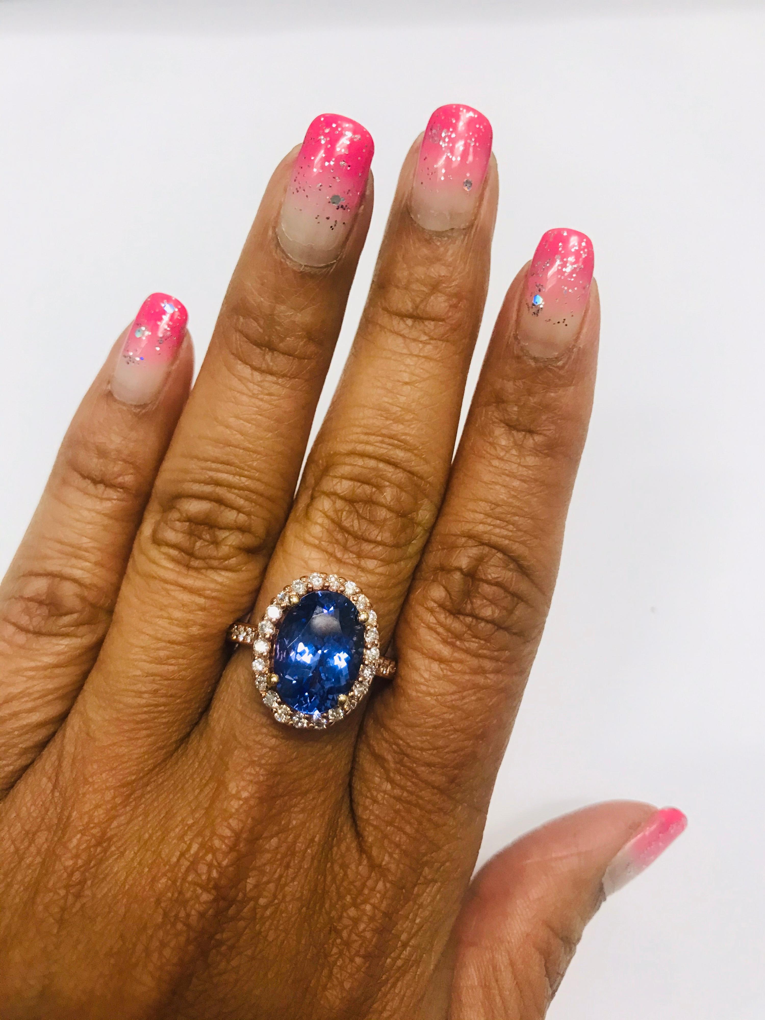 Women's 5.38 Carat Tanzanite Diamond Halo 14 Karat Rose Gold Ring For Sale