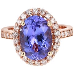 5,38 Karat Tansanit Diamant Halo 14 Karat Rose Gold Ring