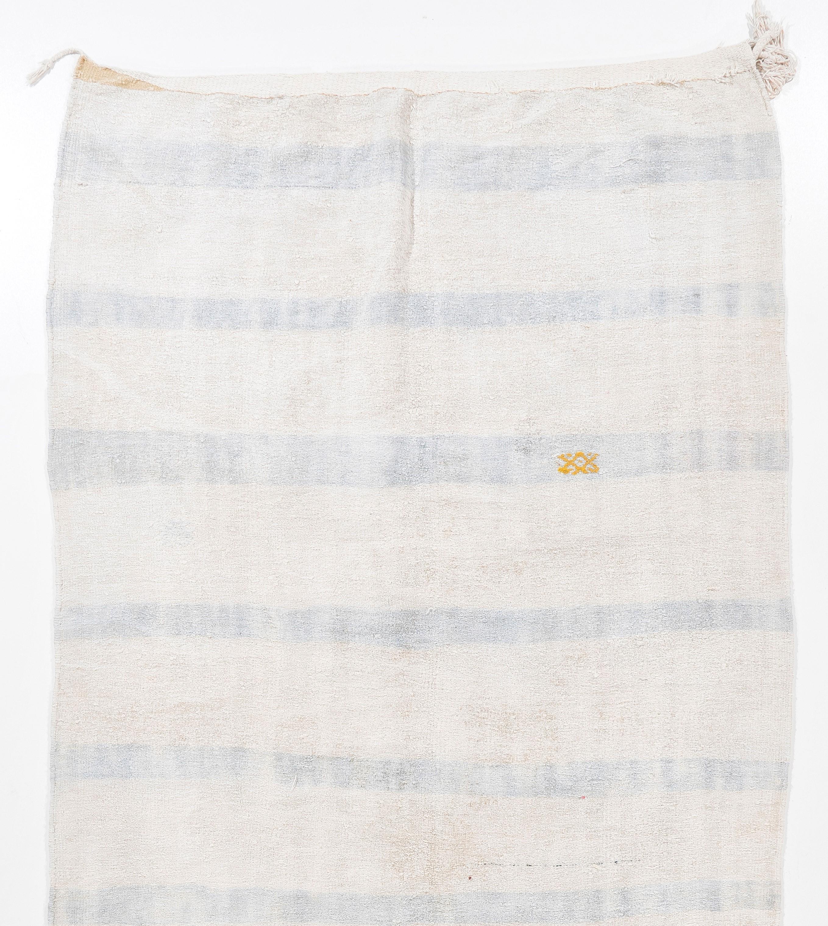 An authentic vintage handmade flat-weave (Kilim) from Eastern Turkey, handwoven by Nomads to be used as floor coverings in their tents and winter homes. This cotton kilim features a simple striped design in washed out tones of blue and pinkish light