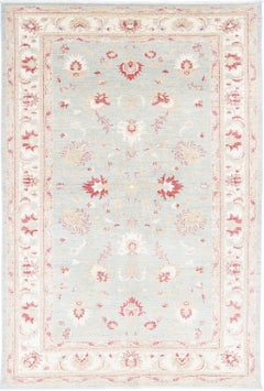 5.3x8 ft Hand Knotted Light Blue and Beige Wool Area Rug with Floral Design
