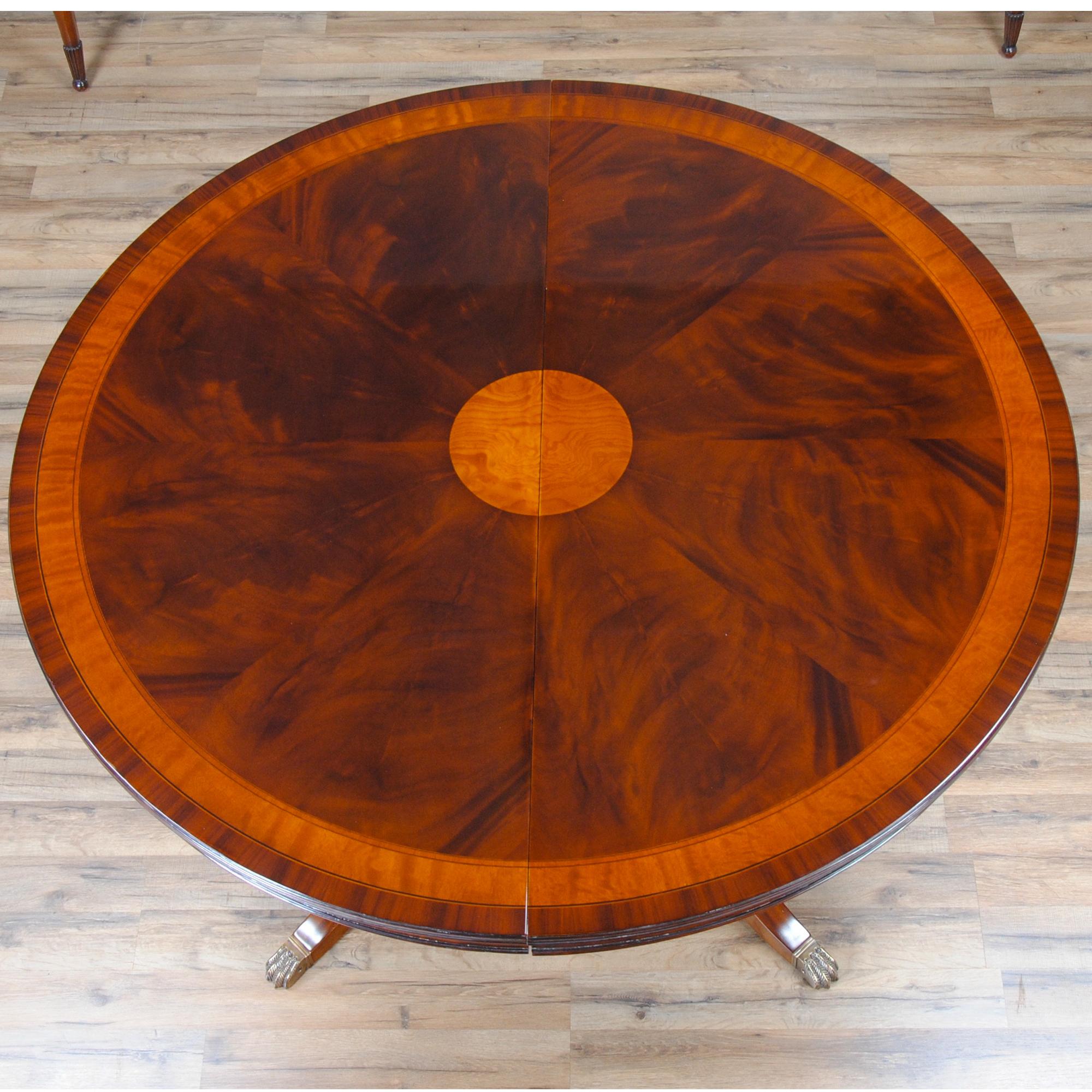 A popular version of the sized 54″-90″ Round Mahogany Table. When closed the table is 54″ round making it suitable for smaller, intimate dinner parties. With the two leaves are put in place the table opens to a maximum length of 90″ and  seating for