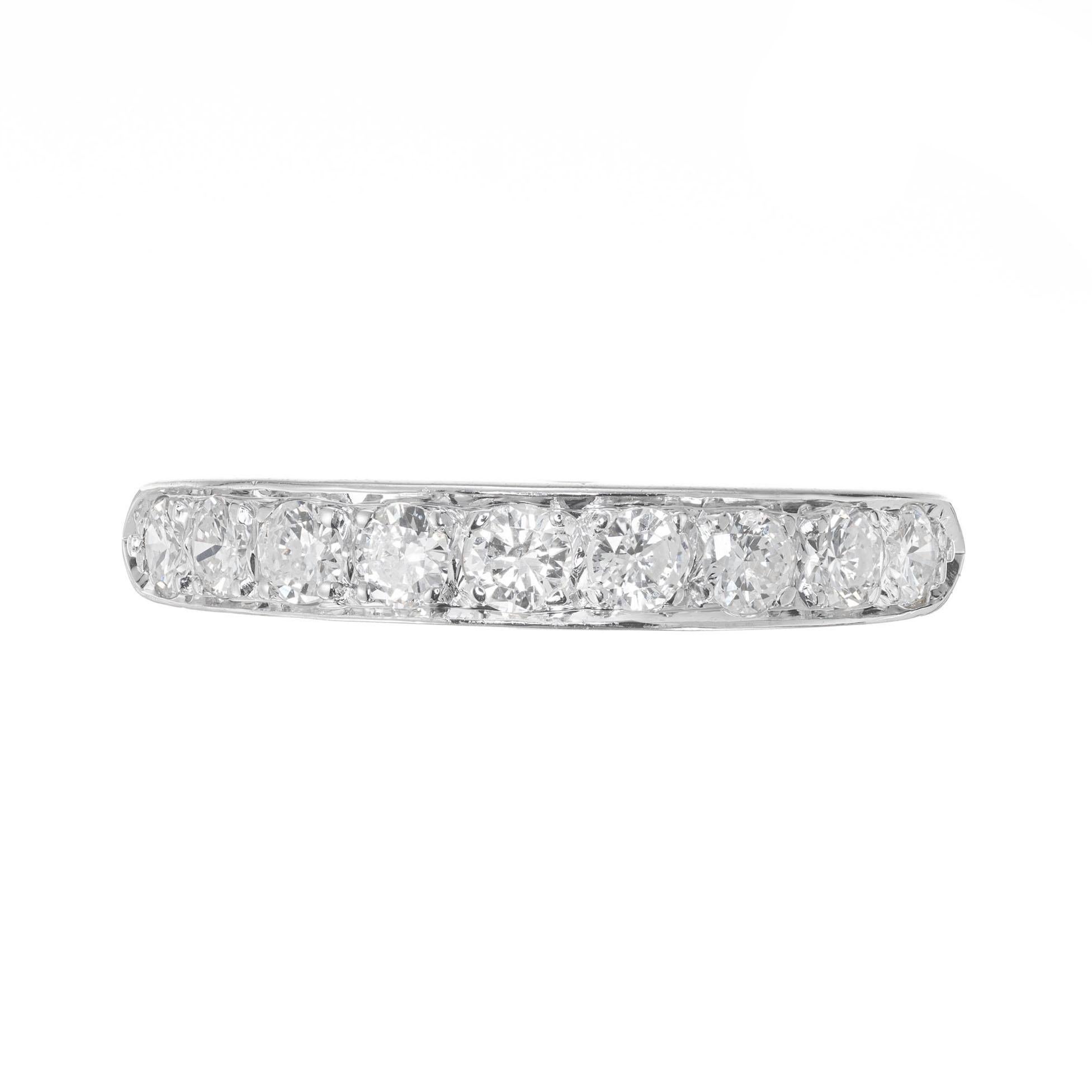 Mid-Century, Diamond wedding band. 9 brilliant cut diamonds bead set in a 14k white gold setting. Circa 1950's.

9 round brilliant cut diamonds, G SI approx. .54cts
Size 6 and sizable
14k white gold 
Stamped: 14k
2.8 grams
Width at top: 3.8mm
Height