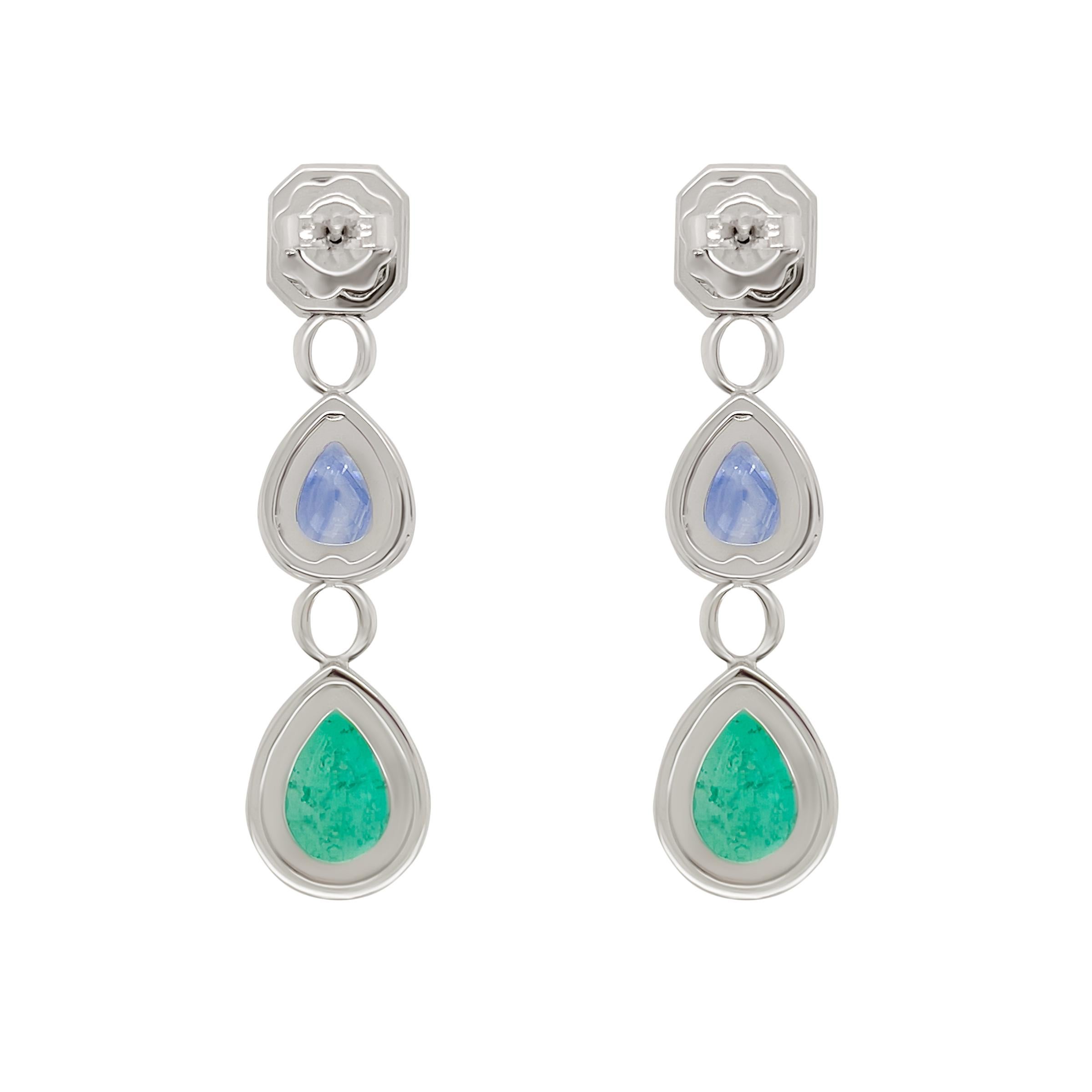 This pair of 18k white gold earrings are classic in design showcasing bright and colourful  natural (no heat ) emeralds and blue sapphires. The emeralds totaling 5.4 carats and 3.93 carats of blue sapphire are surrounded by pave’d white diamonds.