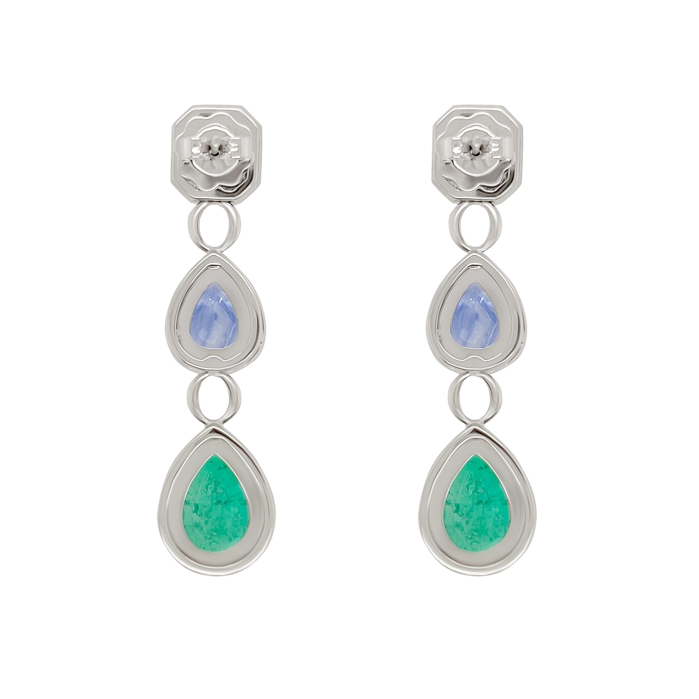 This pair of 18k white gold earrings are classic in design showcasing bright and colourful emeralds and blue sapphires. The emeralds totaling 5.4 carats and 3.93 carats of blue sapphire are surrounded by pave’d white diamonds. These earrings were