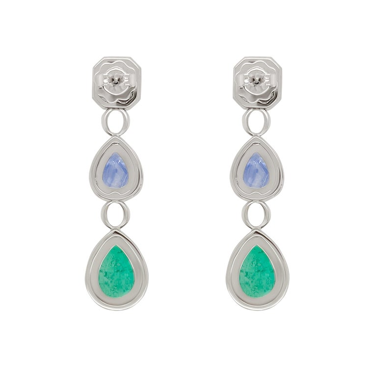 This pair of 18k white gold earrings are classic in design showcasing bright and colourful emeralds and blue sapphires. The emeralds totaling 5.4 carats and 3.93 carats of blue sapphire are surrounded by pave’d white diamonds. These earrings were