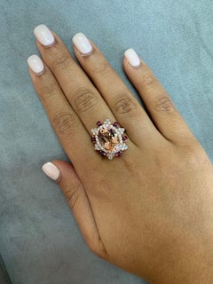 Sunita Nahata Morganite 5.47ct. Fancy Ring in 18KRG with Rhodolite and Diamond.