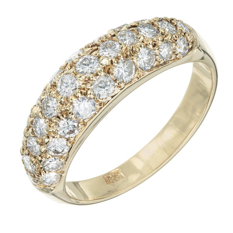 1960's Diamond dome band ring. 32 round brilliant cut pave diamonds in a three row 18k yellow gold band setting.

32 round brilliant cut diamonds, G-H VS approx. .54cts
Size 6.75 and sizable 
18k yellow gold 
Stamped: 18k
4.0 grams
Width at top: