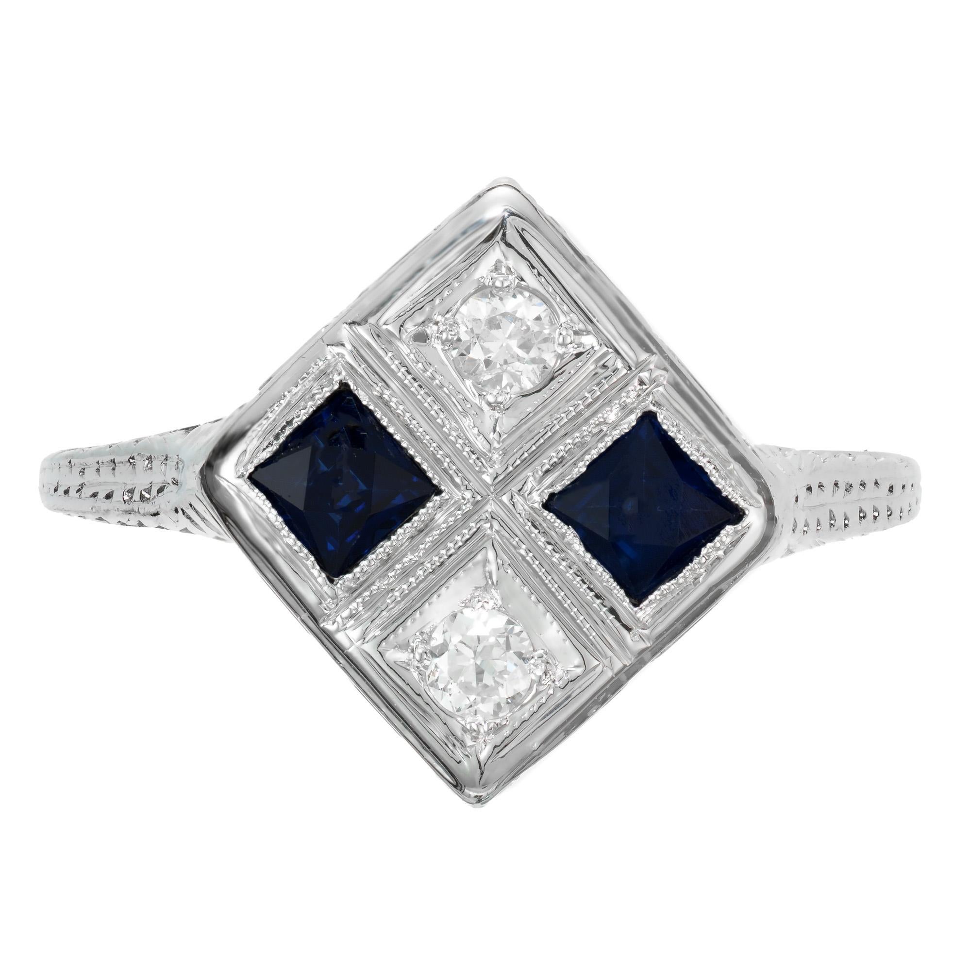 Late Art Deco 1940's sapphire and diamond ring. 2 square shaped sapphires set sideways in a platinum engraved setting with 2 round accent diamonds.

2 calibre cut square Sapphires, approx. total weight .30cts, 2.5mm
2 European full cut diamonds,