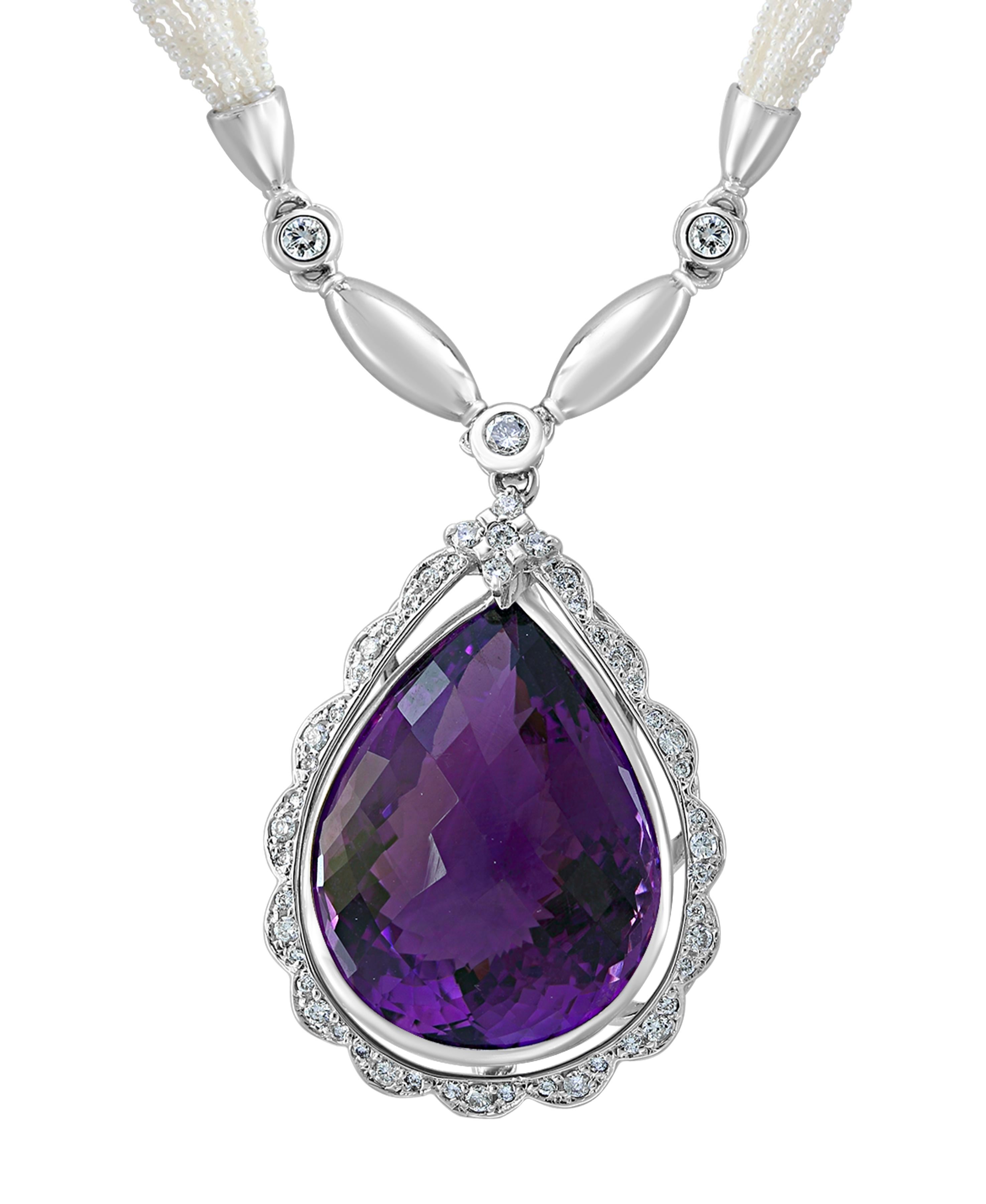 54 Carat  Tear Drop Amethyst & Diamonds with Seed Pearl Necklace  18 K Gold
18 K White Gold 
This extraordinary Necklace is consist  of  Fine  large 54.5 carats Tear Drop natural  Amethyst 
This large Amethyst pendulam is hanging from very tiny seed